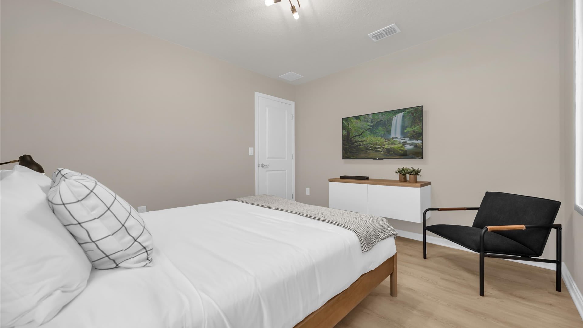 Elegant Queen Bedroom with a Smart TV 