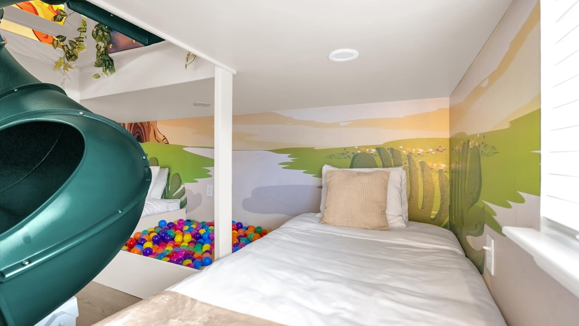 Colourful kids’ bedroom featuring a spiral slide, themed bedding, and playful energy.
