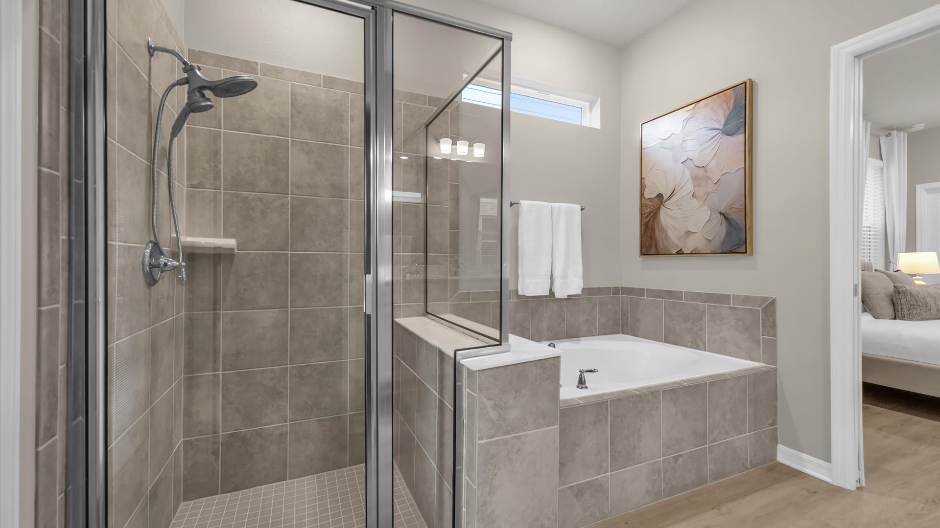 En-suite bathroom with standing shower and jacuzzi 