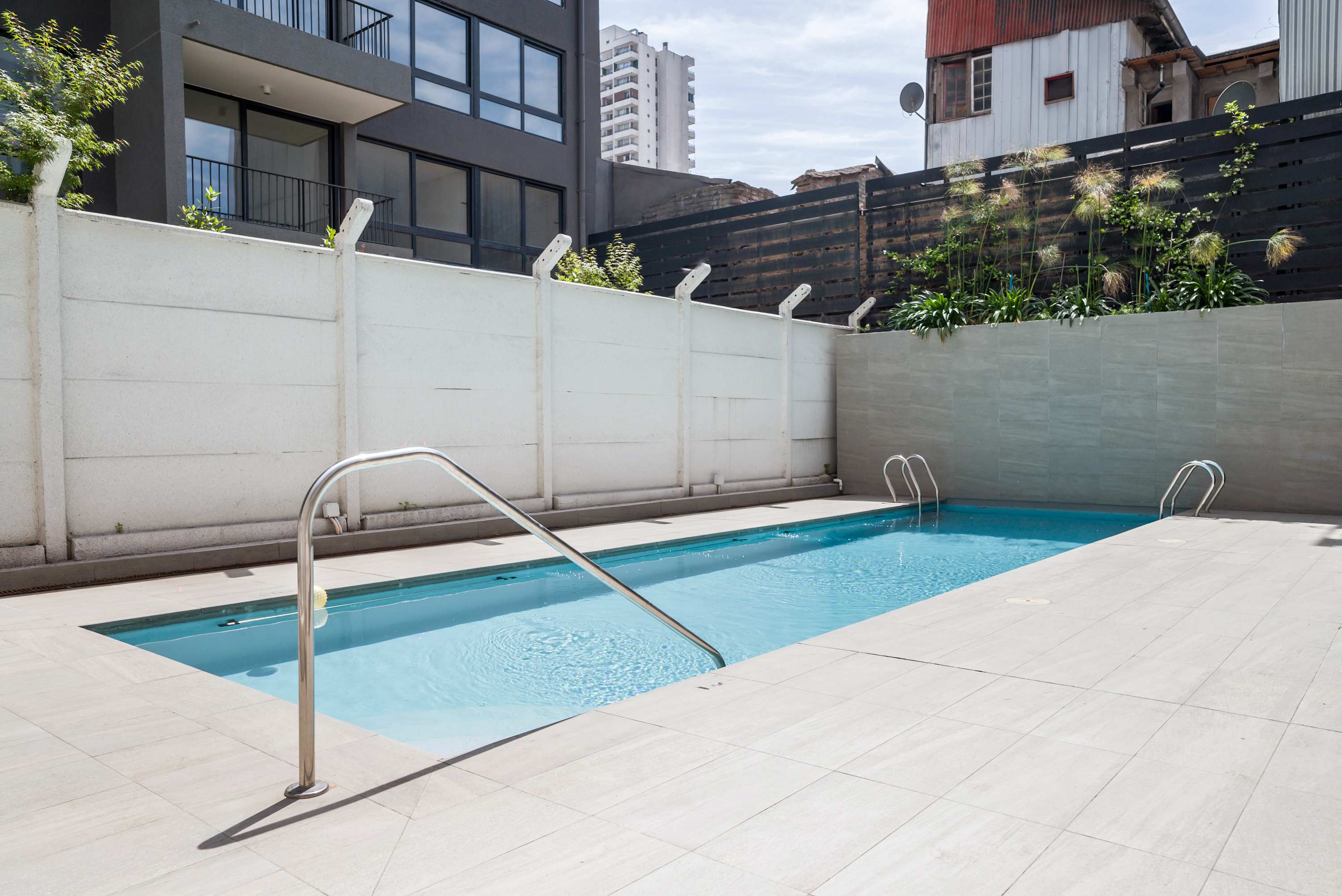 Enjoy a refreshing swim in the outdoor pool, perfect for relaxation on sunny days.