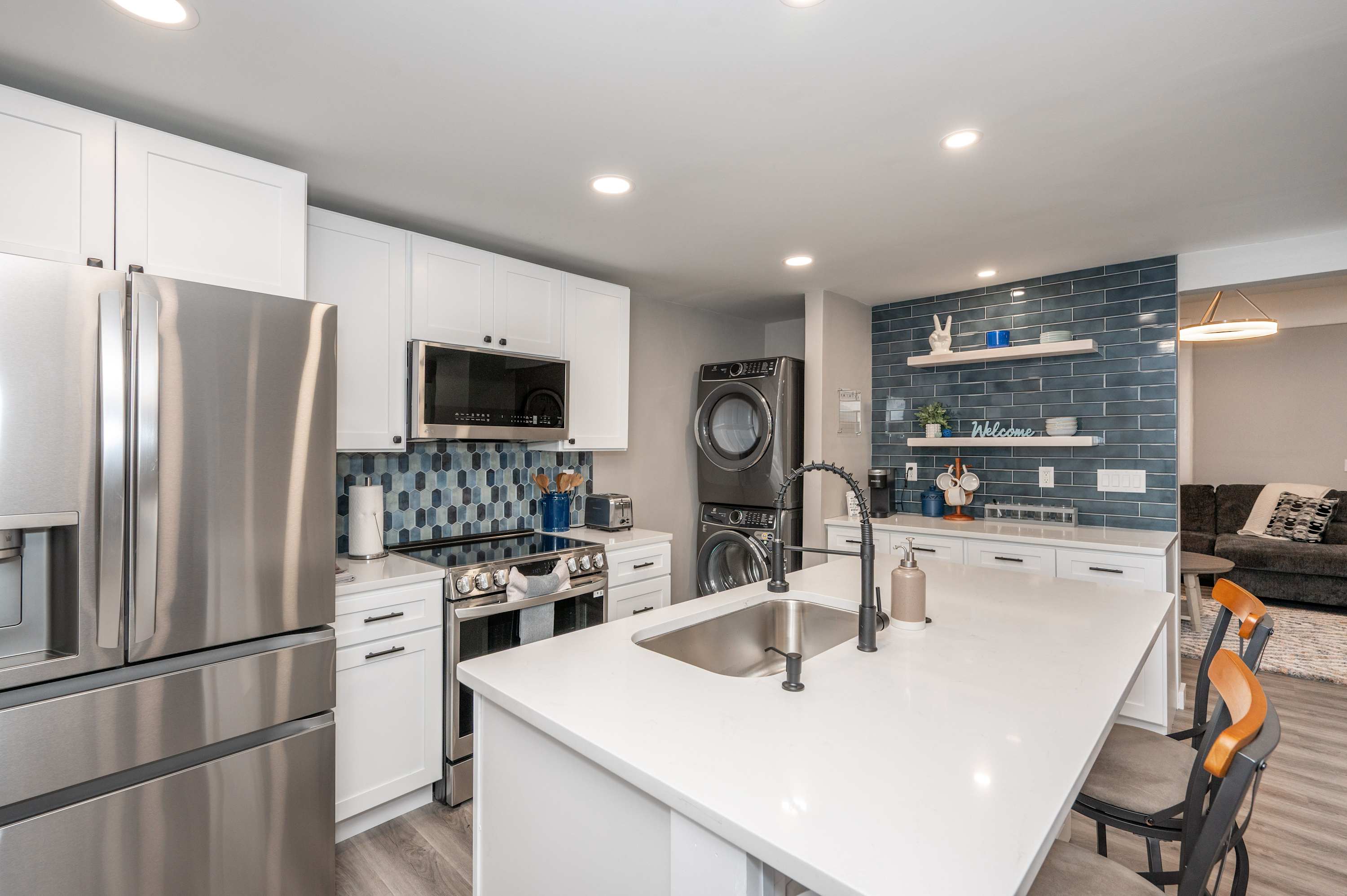 The chic, open kitchen offers ample space & all the comforts of home​