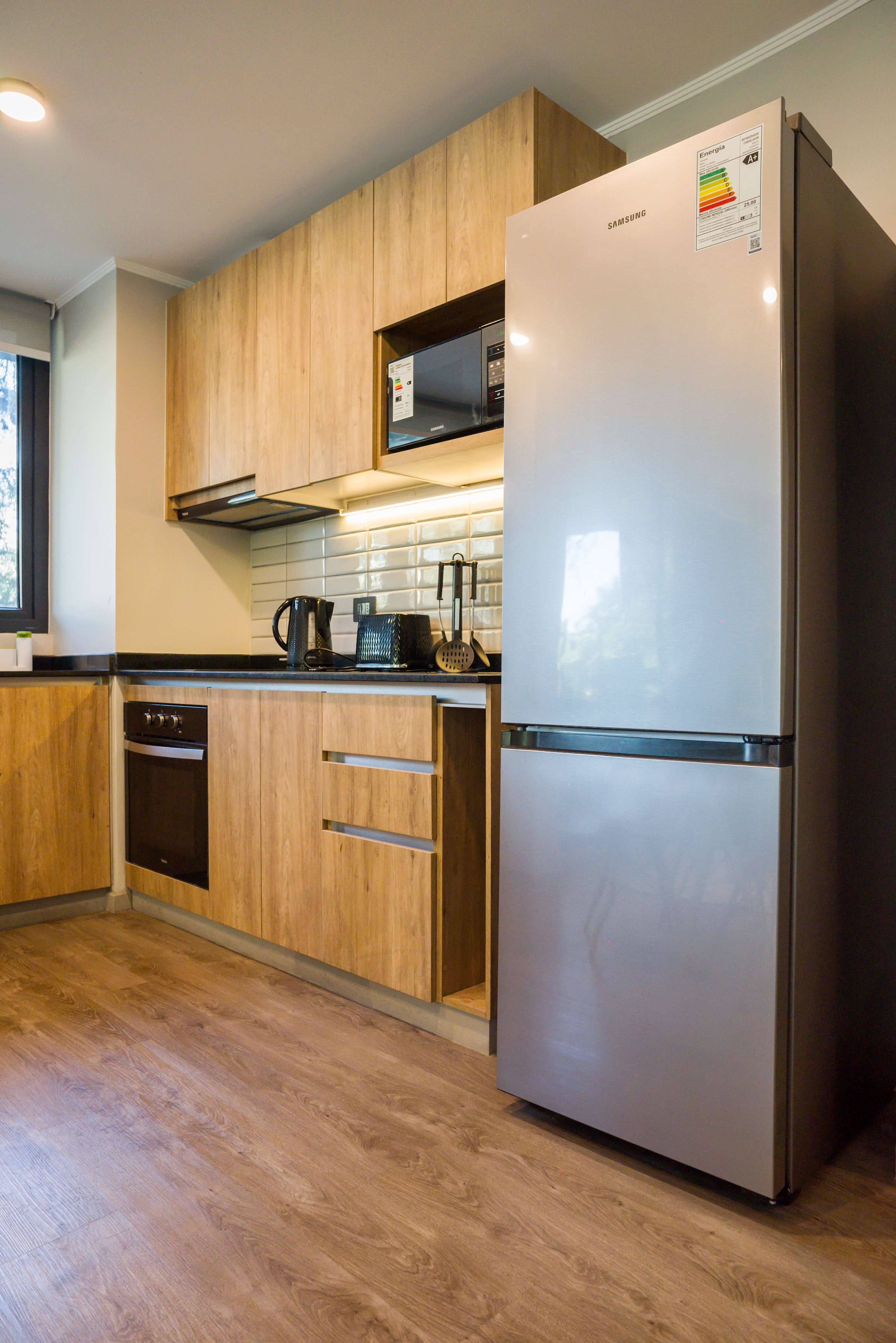 Modern kitchen with sleek appliances and all essentials for a comfortable stay in the heart of Chile.