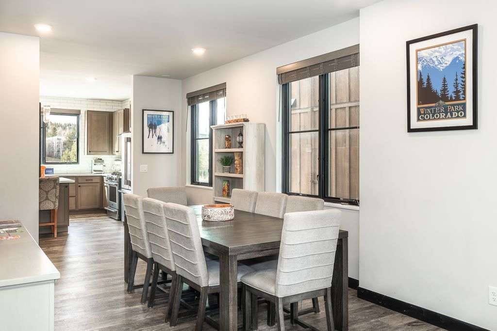 Gather around a sunlit dining table that invites connection, conversation, and lingering moments after a day of adventure.