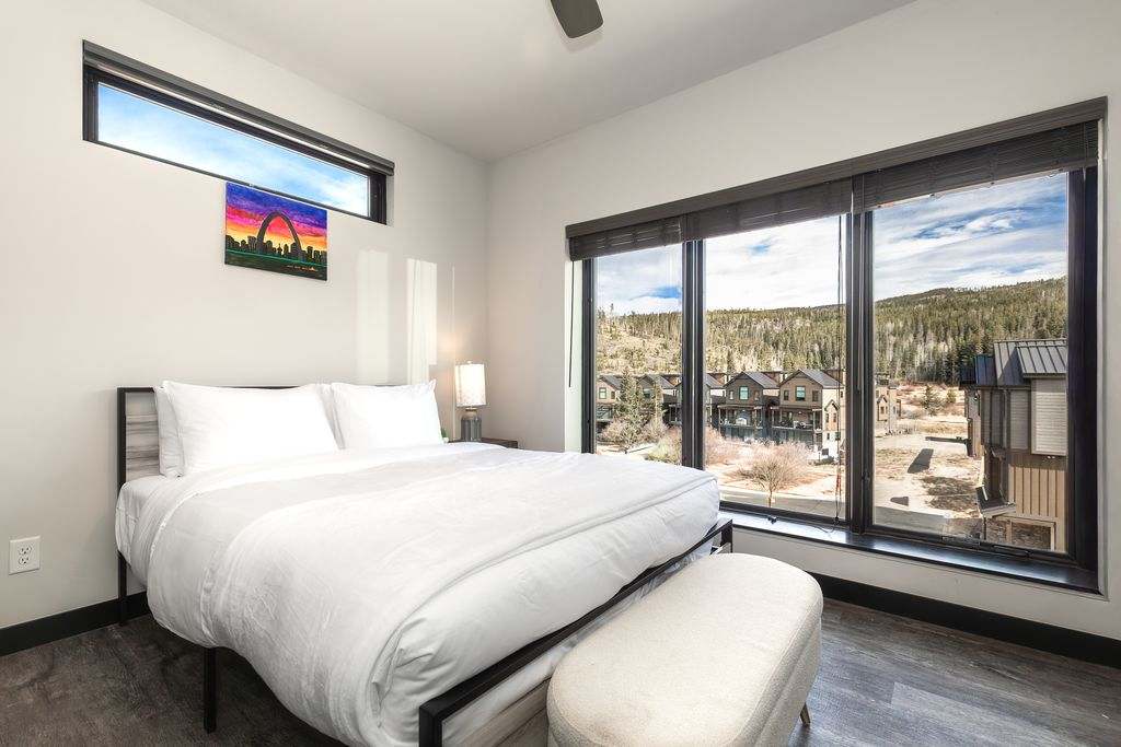 Wake to soft morning light and serene mountain views in a bedroom designed for rest, renewal, and quiet luxury.