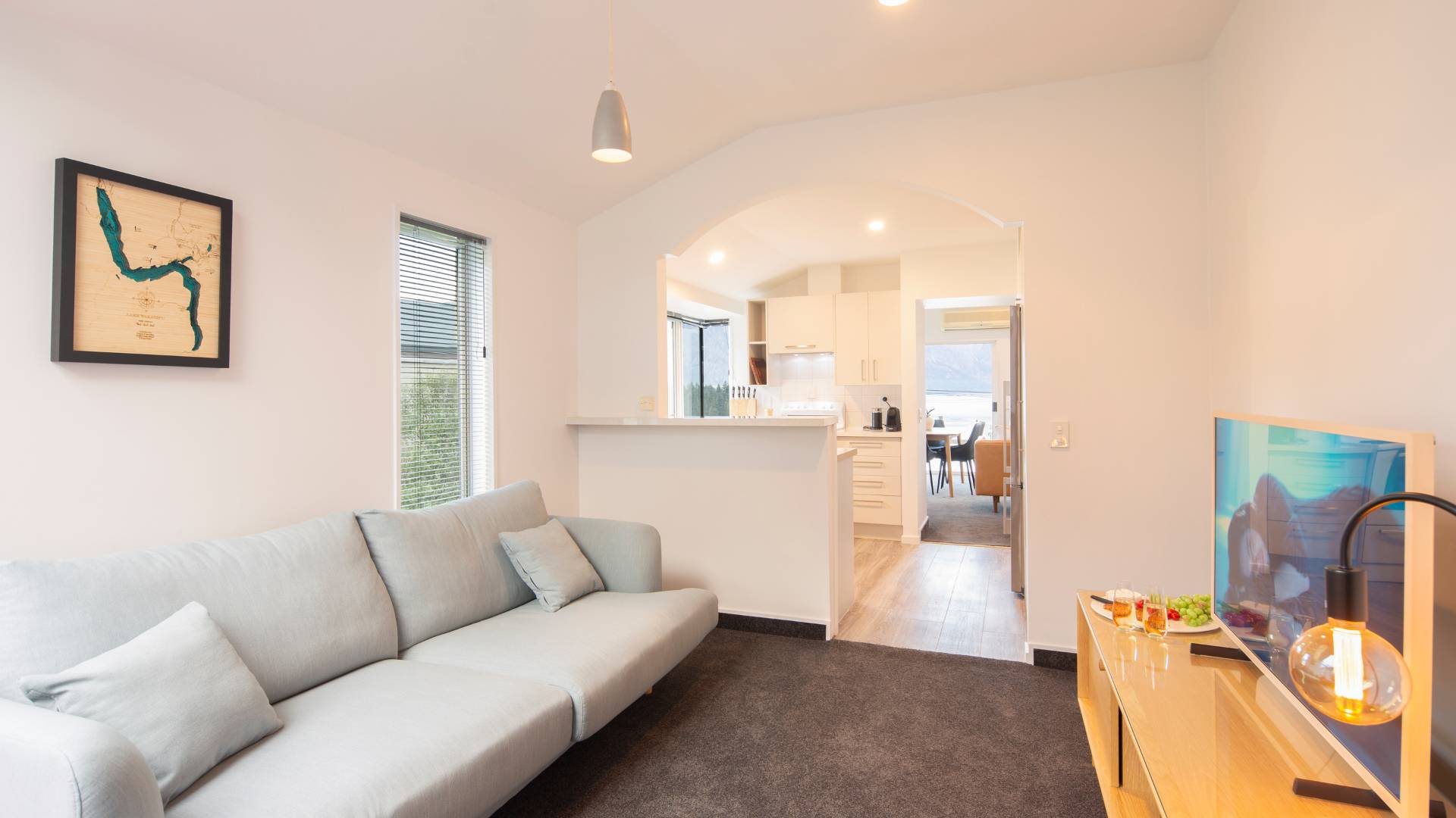 A second cozy lounge with a TV awaits in your luxury accom, Queenstown