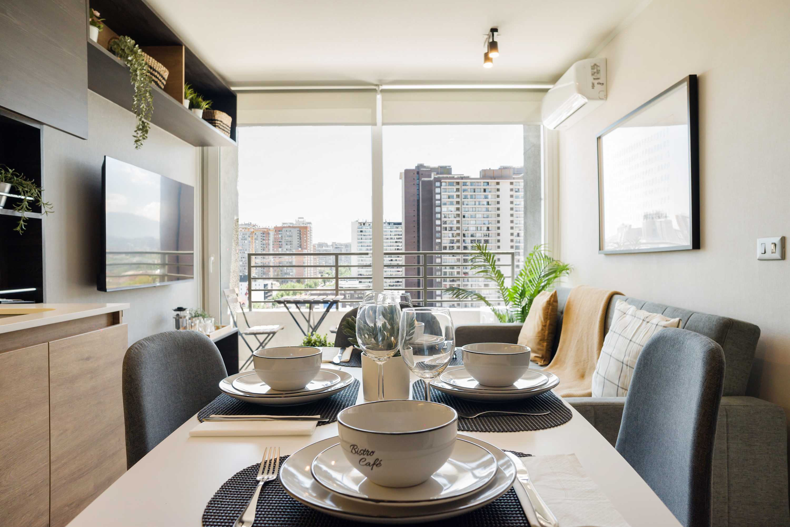 Savor meals with stunning city views in this stylish dining area, complete with modern decor and a cozy ambiance.