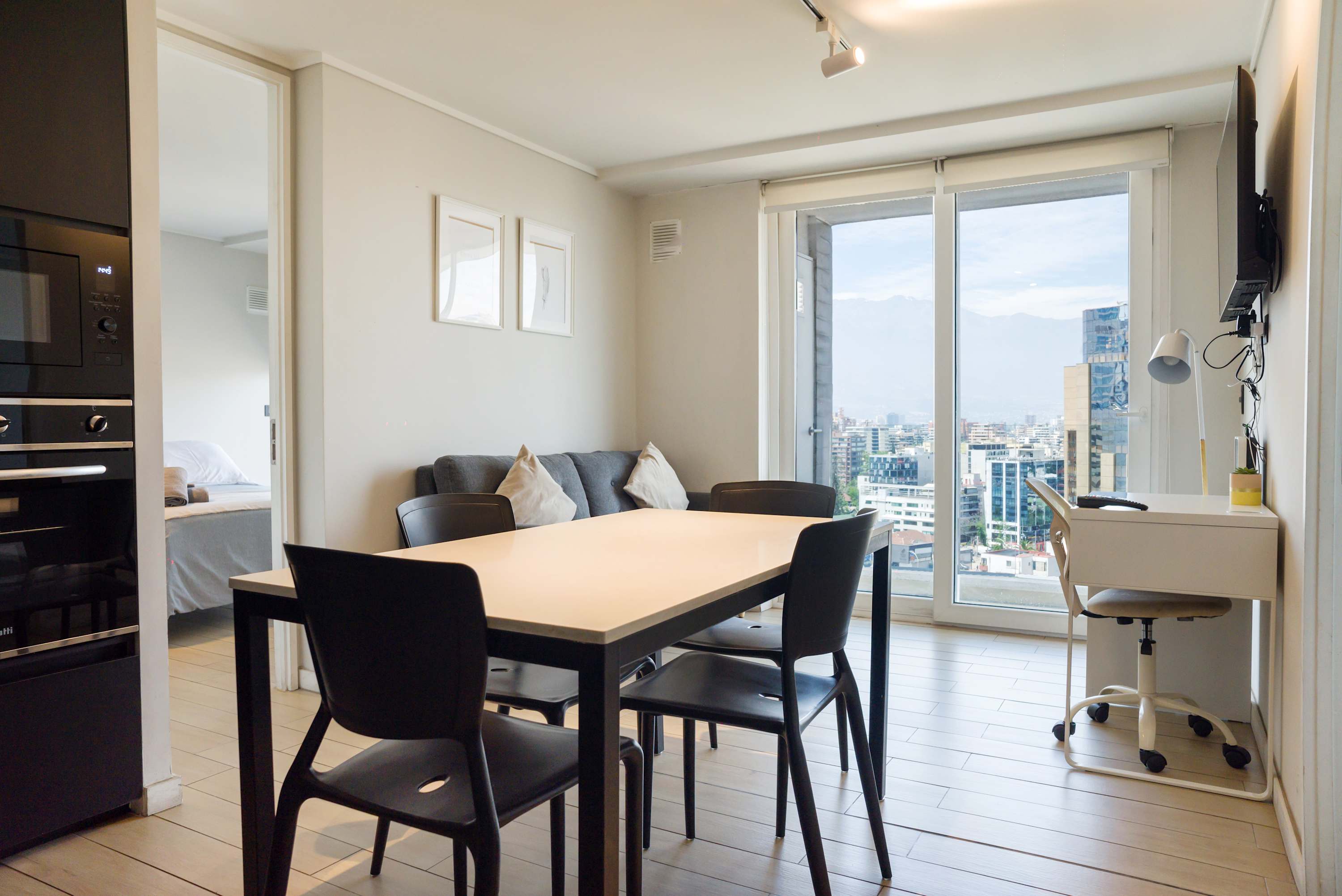Bright and modern living space with stunning city views, perfect for relaxation or work.