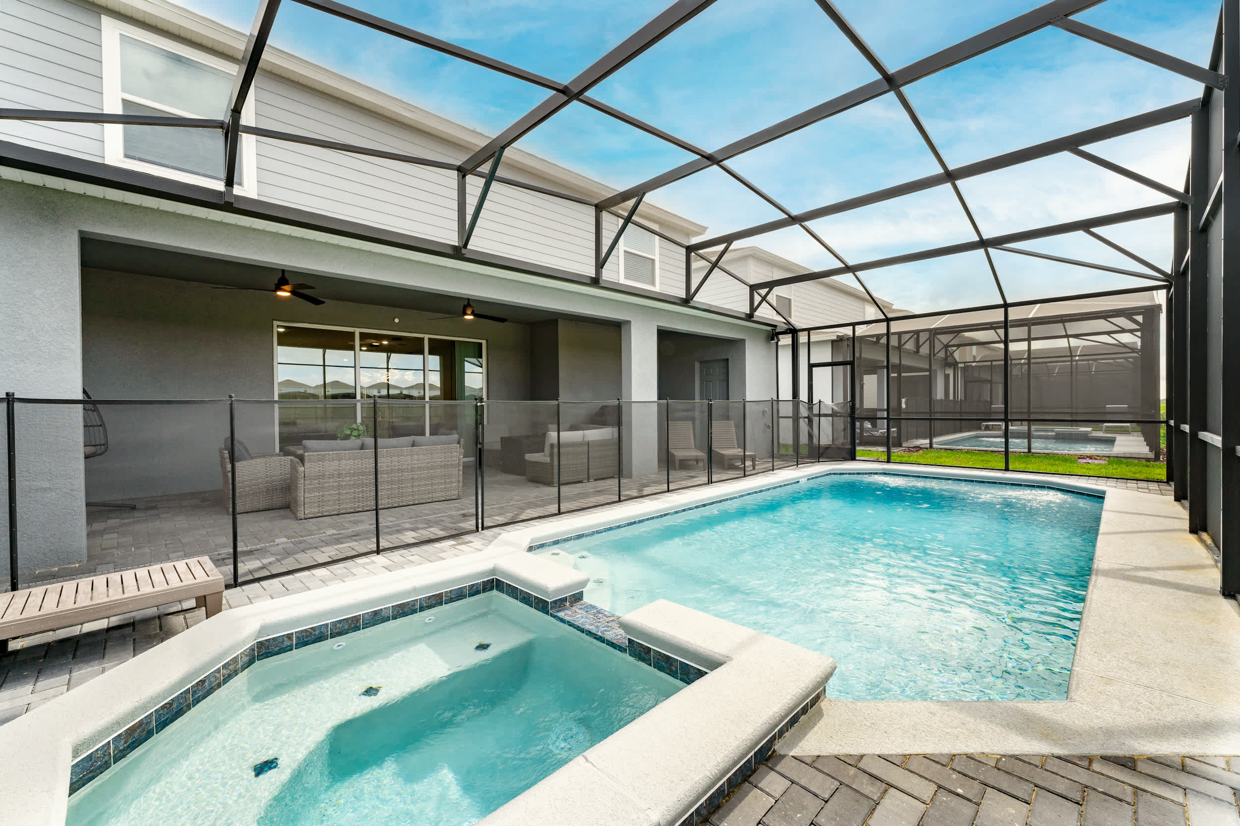 Relax in your private screened pool and hot tub, perfect for family fun or unwinding after a day of adventure.