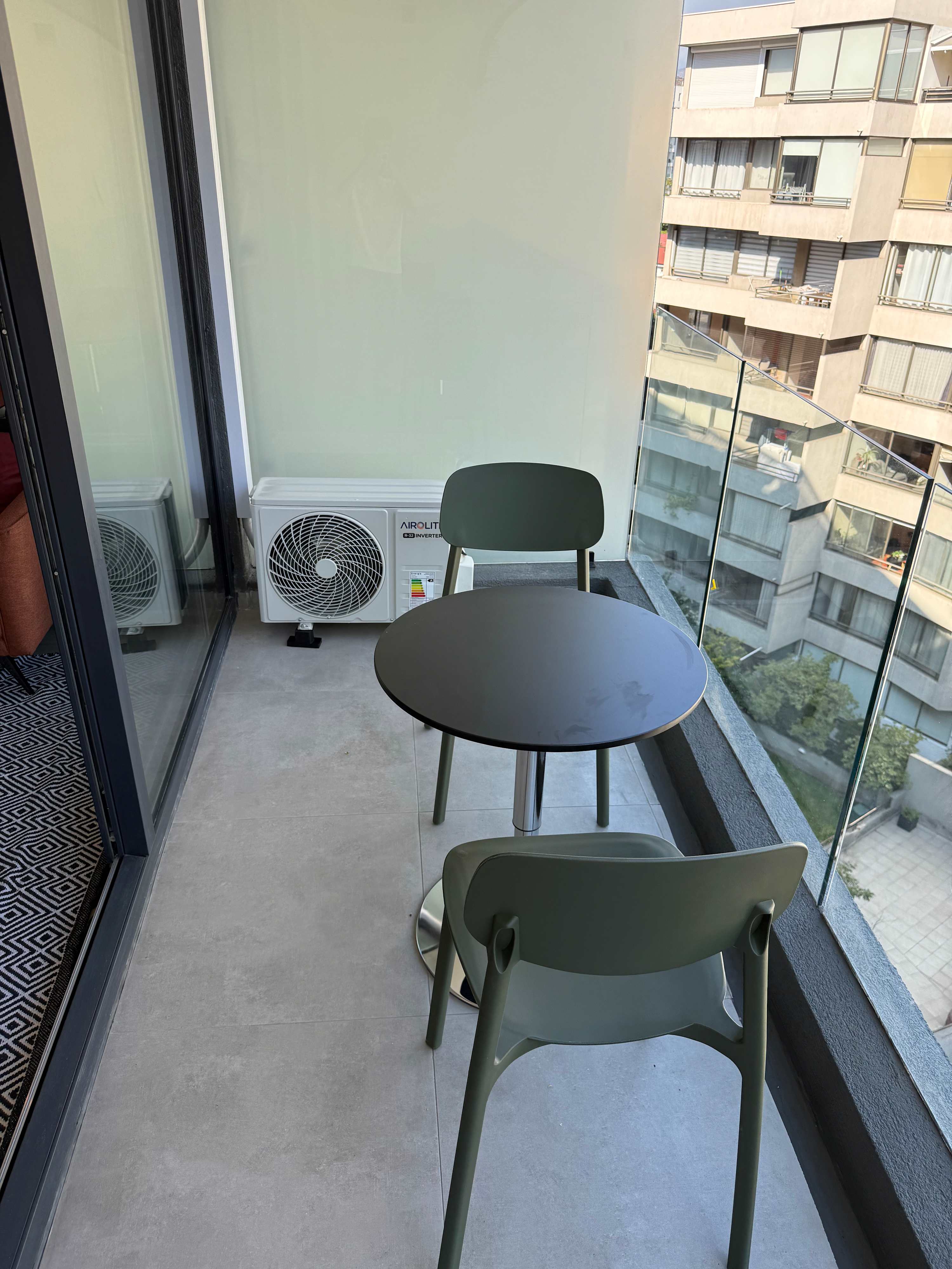 Cozy balcony with city views, perfect for enjoying a morning coffee or evening relaxation.