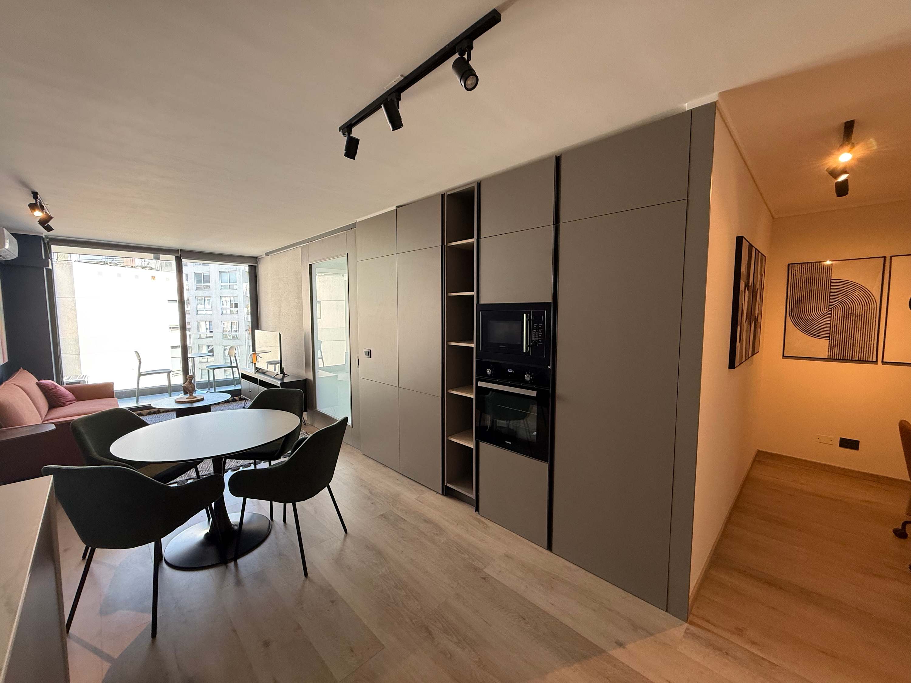 Modern studio with chic dining, cozy seating, and stunning city views. Perfect for a stylish urban getaway.