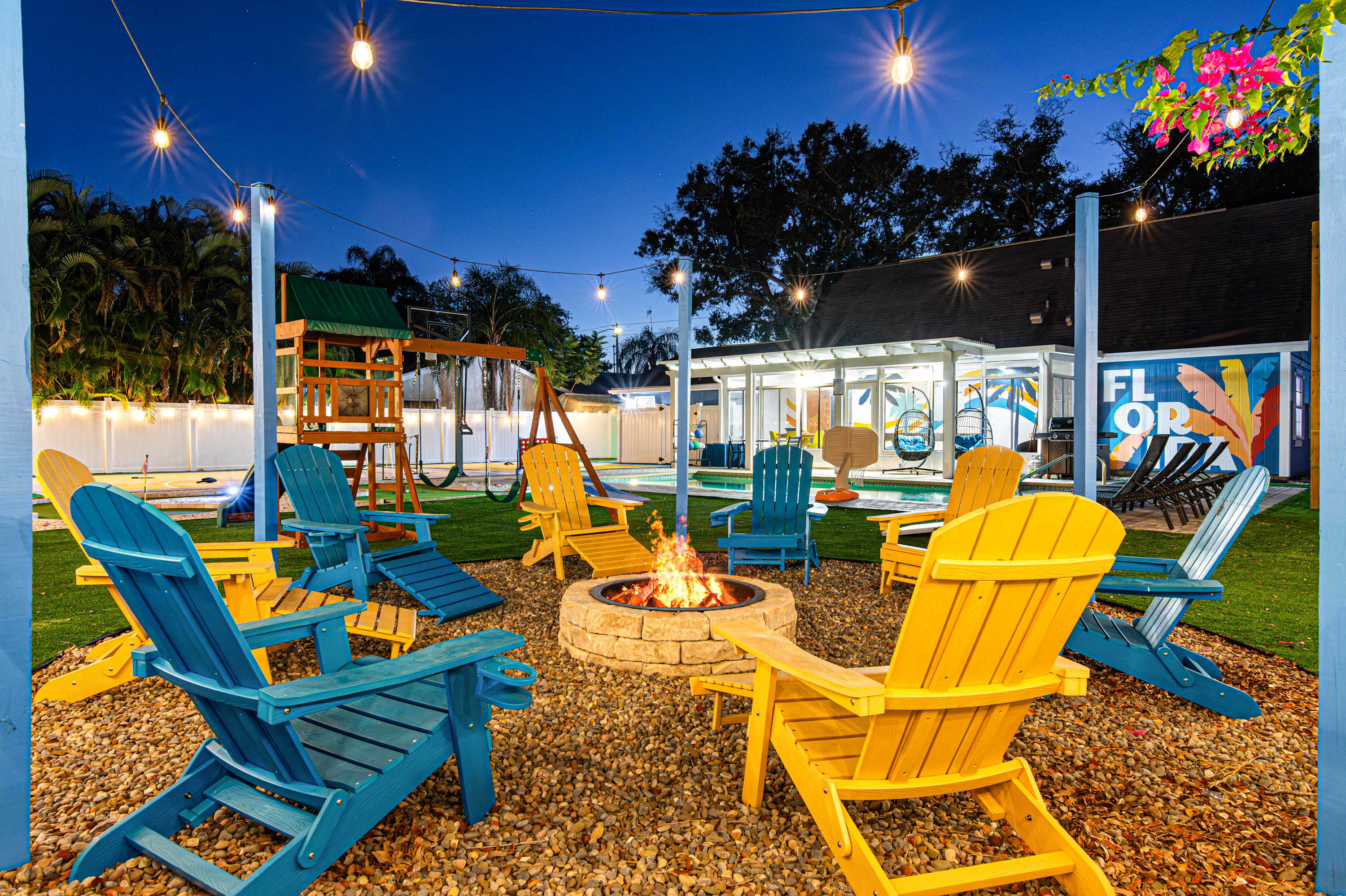 Backyard firepit, kids' play area, and saltwater pool