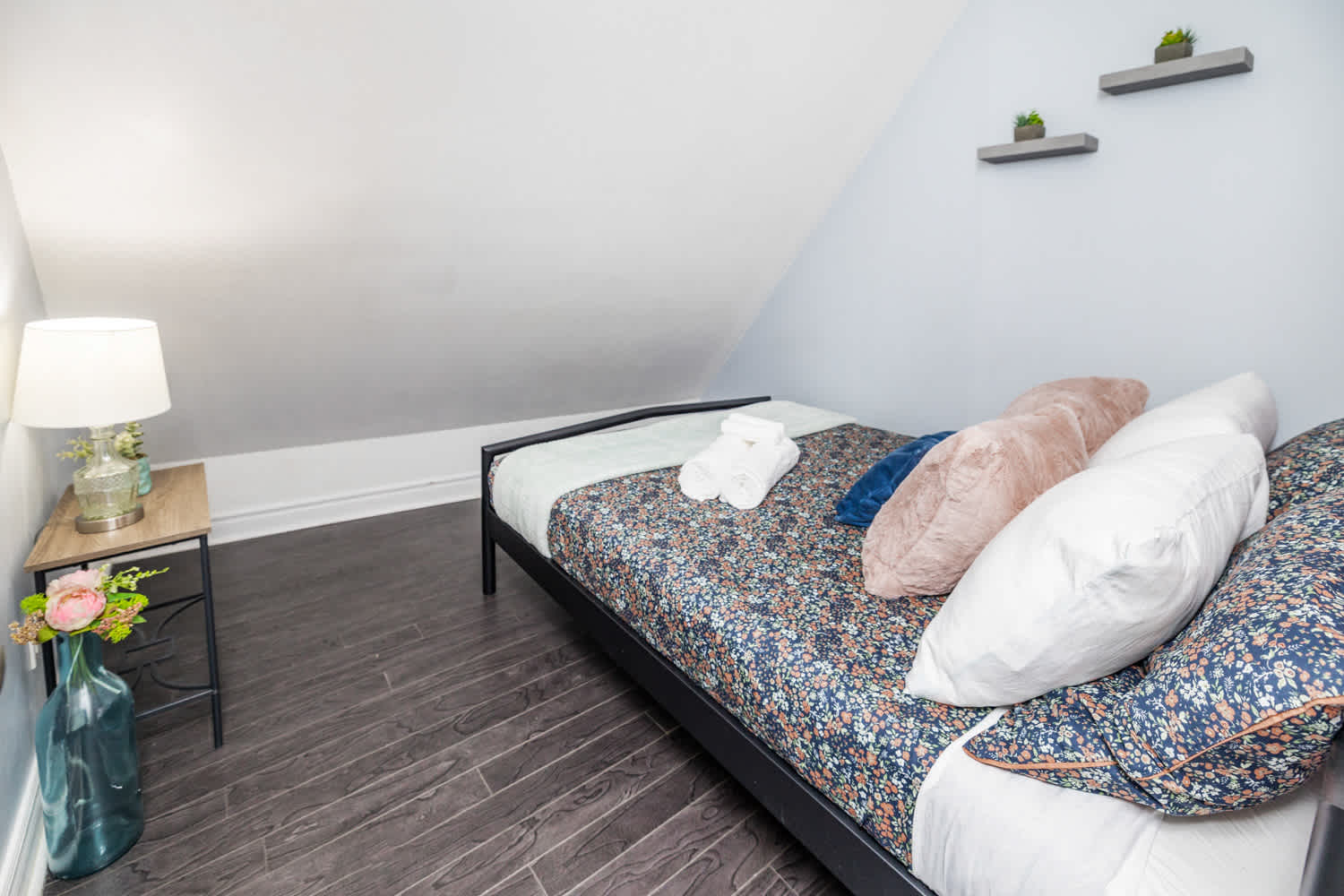 Chic bedroom with a double bed and fresh linens 