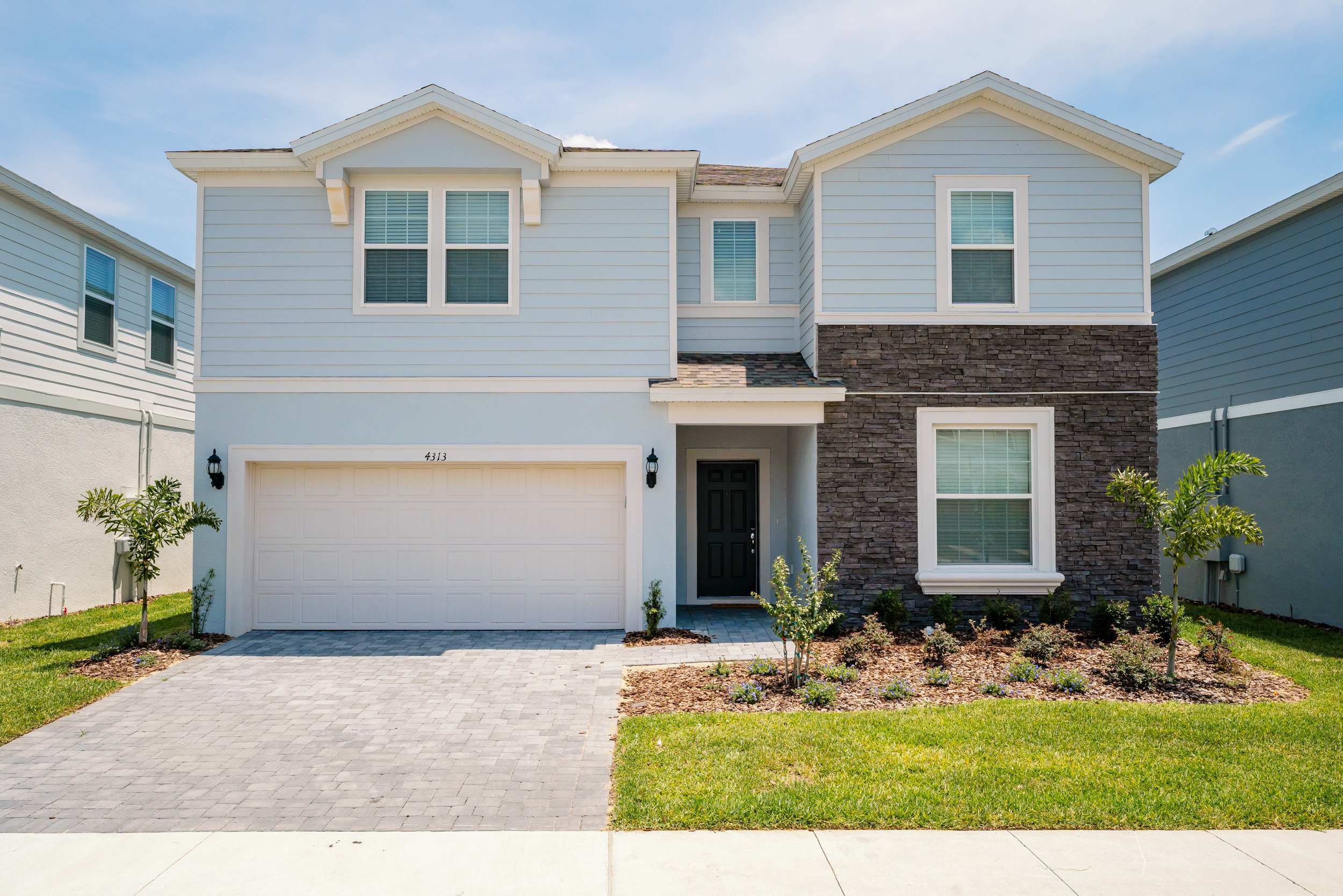Spacious villa with modern design and inviting curb appeal, perfect for large gatherings and family vacations.