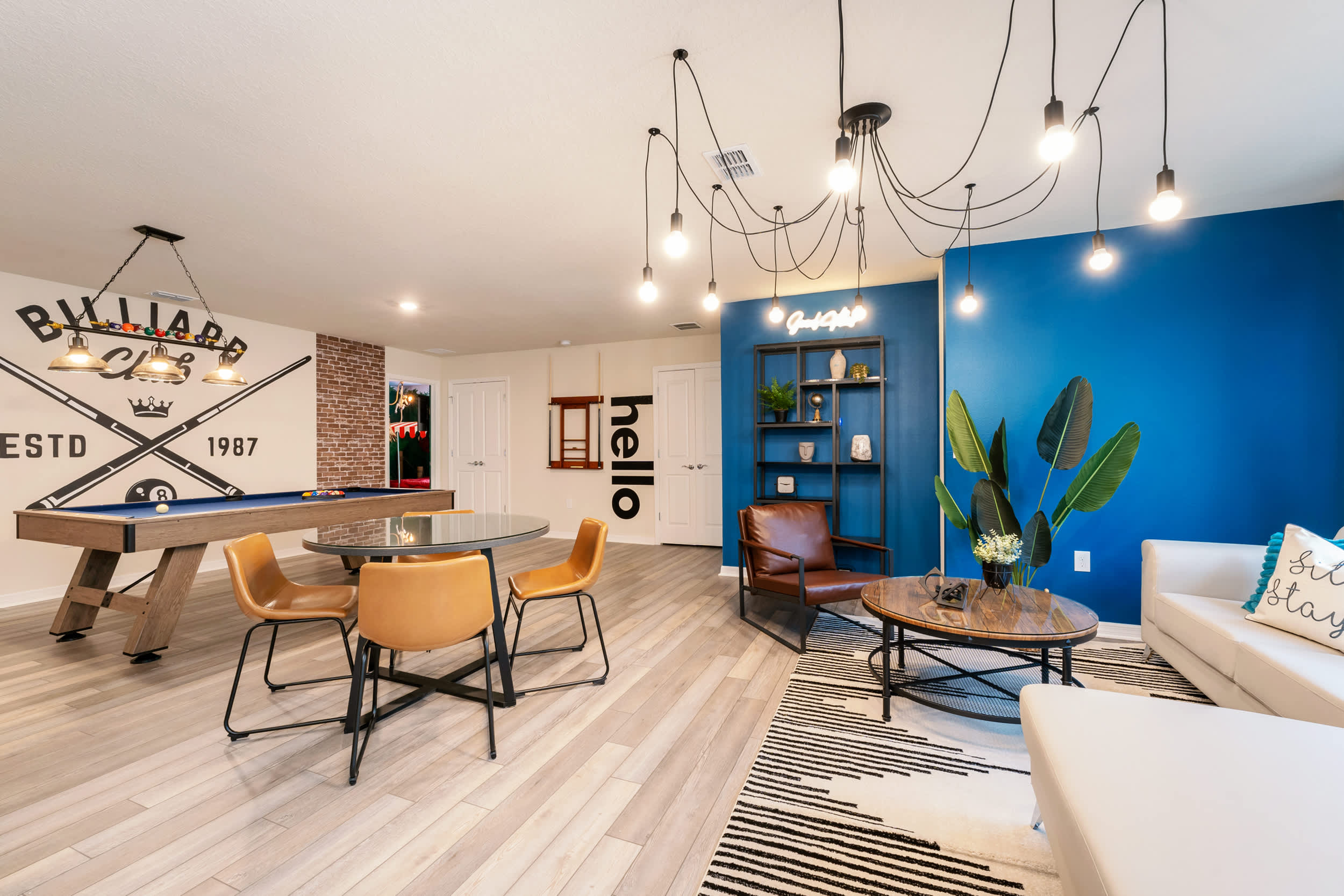 Enjoy a game of billiards or relax in style in this vibrant and modern game room, perfect for entertaining and unwinding.