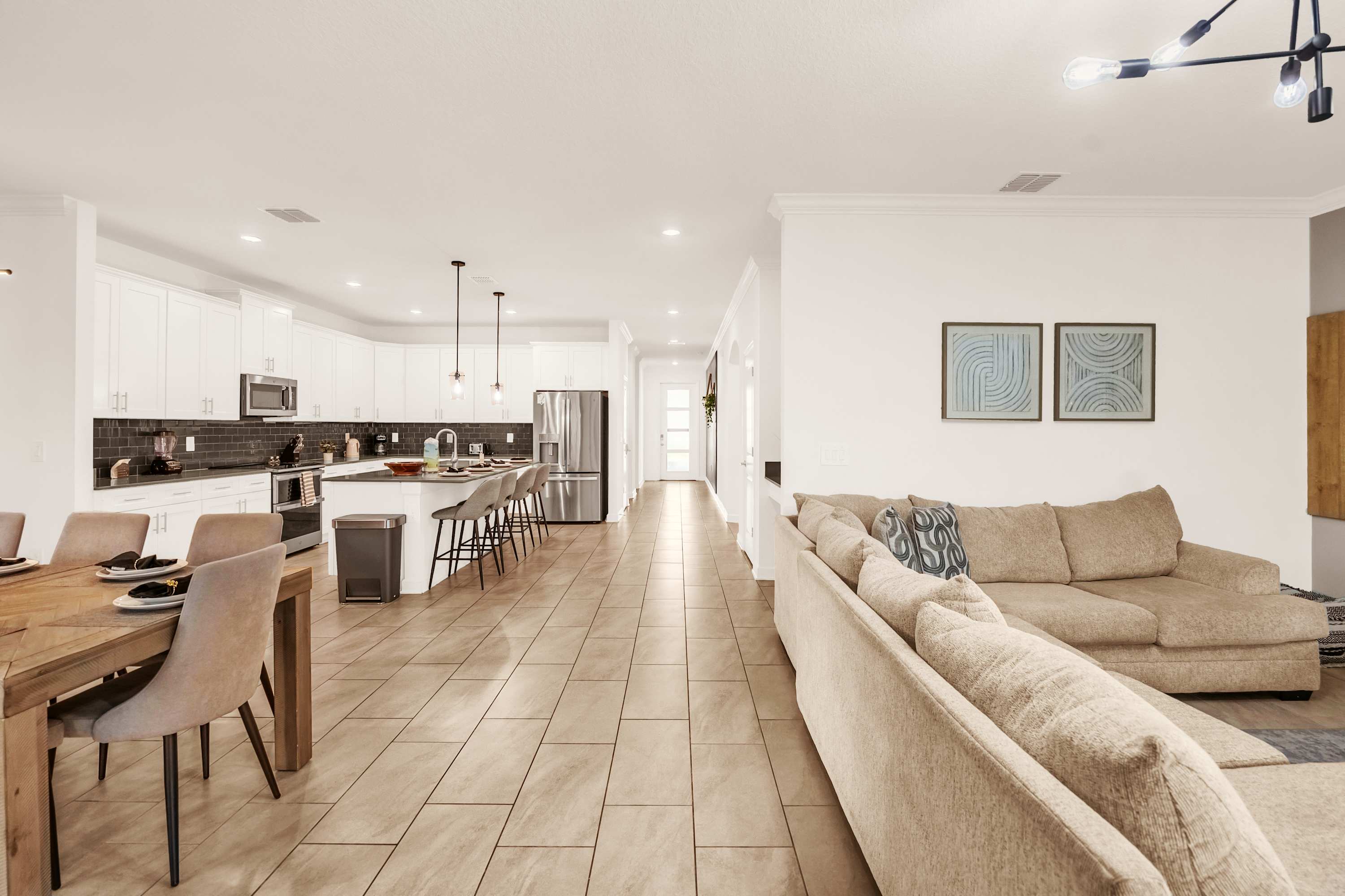 Experience luxury in this spacious open-plan living and kitchen area, perfect for entertaining and relaxation.