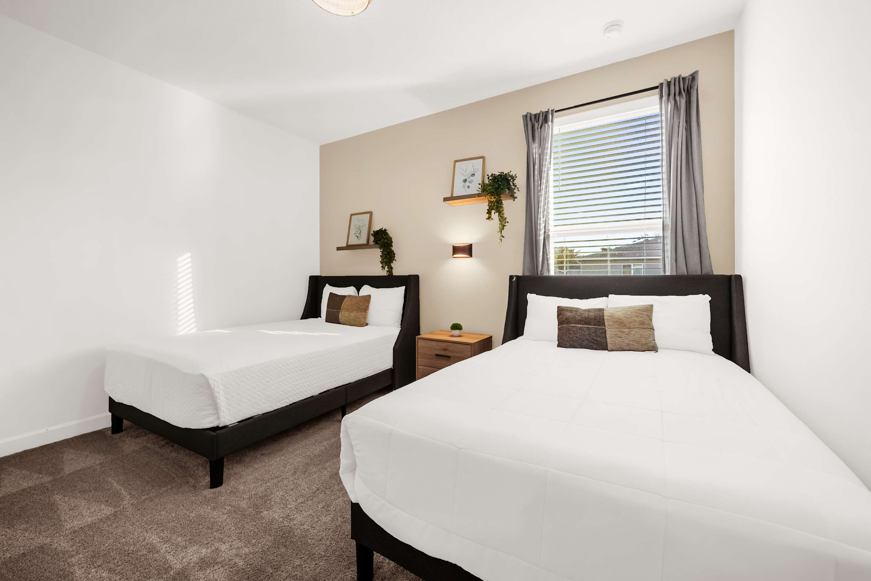 Relax in this cozy bedroom with two double beds, perfect for a restful night's sleep after a day of exploring.