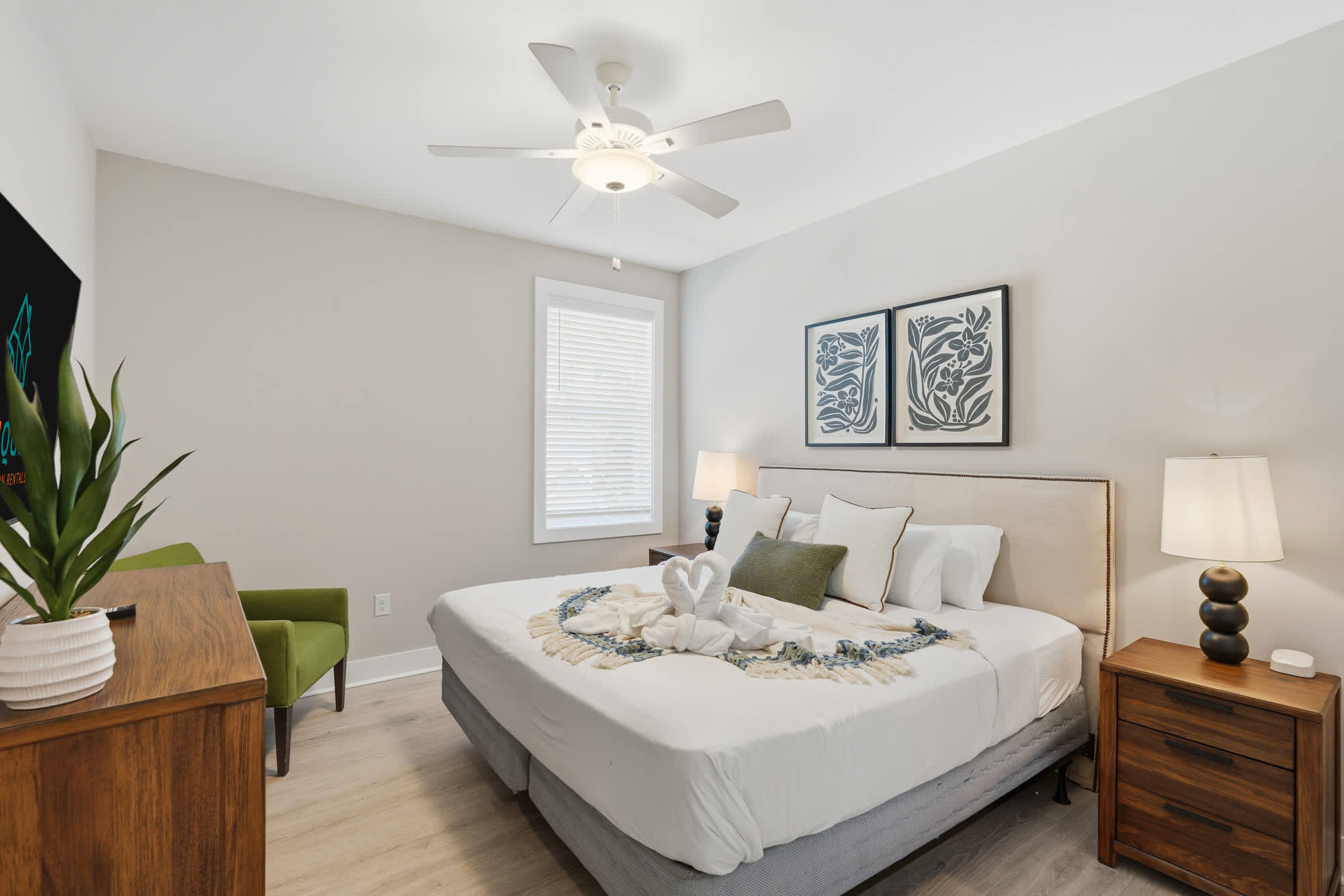 38 W Willow Mist Rd – Cozy bedroom with a queen bed, decorative pillows, nightstand, lamp, and an armchair.