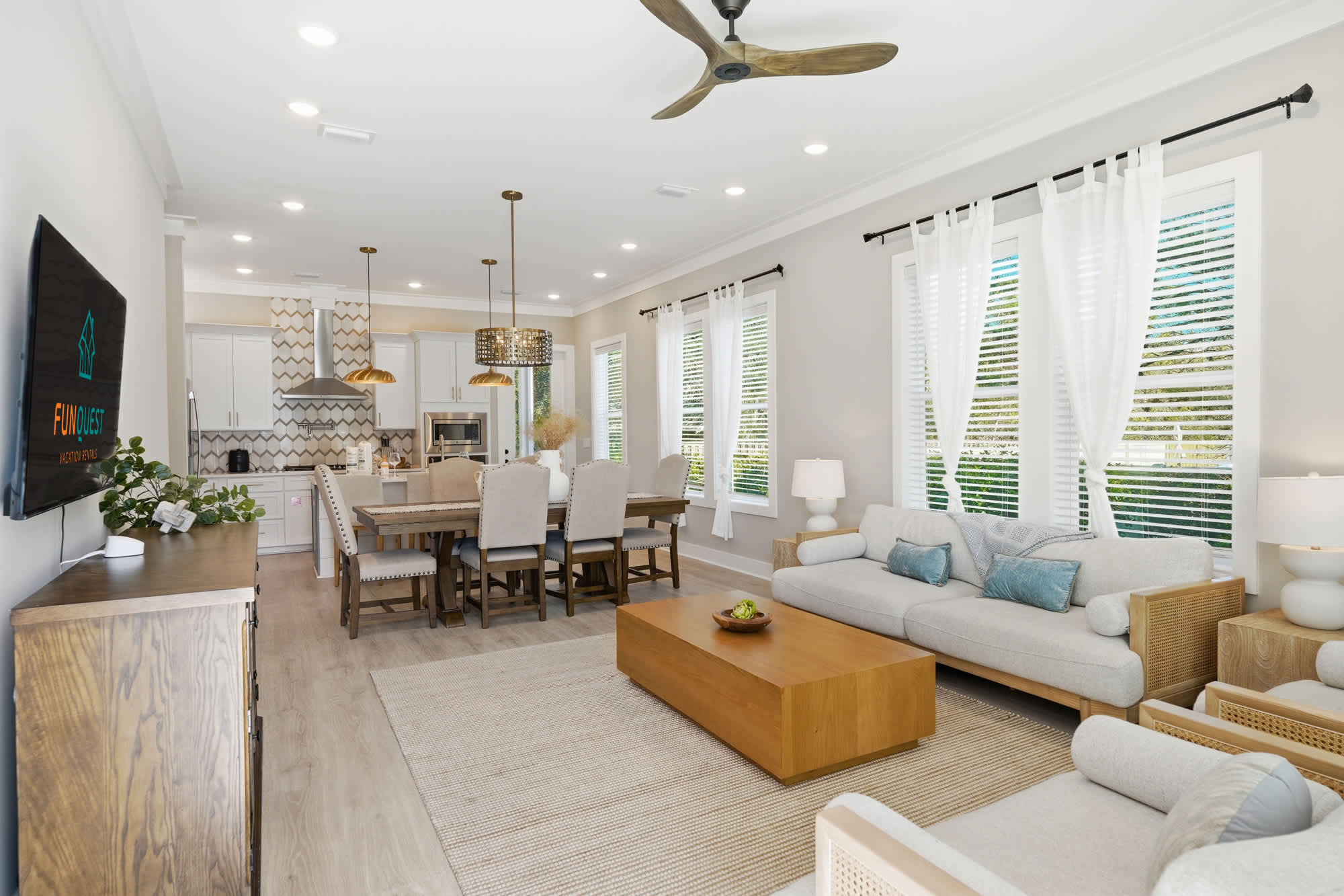 38 W Willow Mist Rd – Living room and dining area with modern furniture, large windows, and a neutral color scheme.