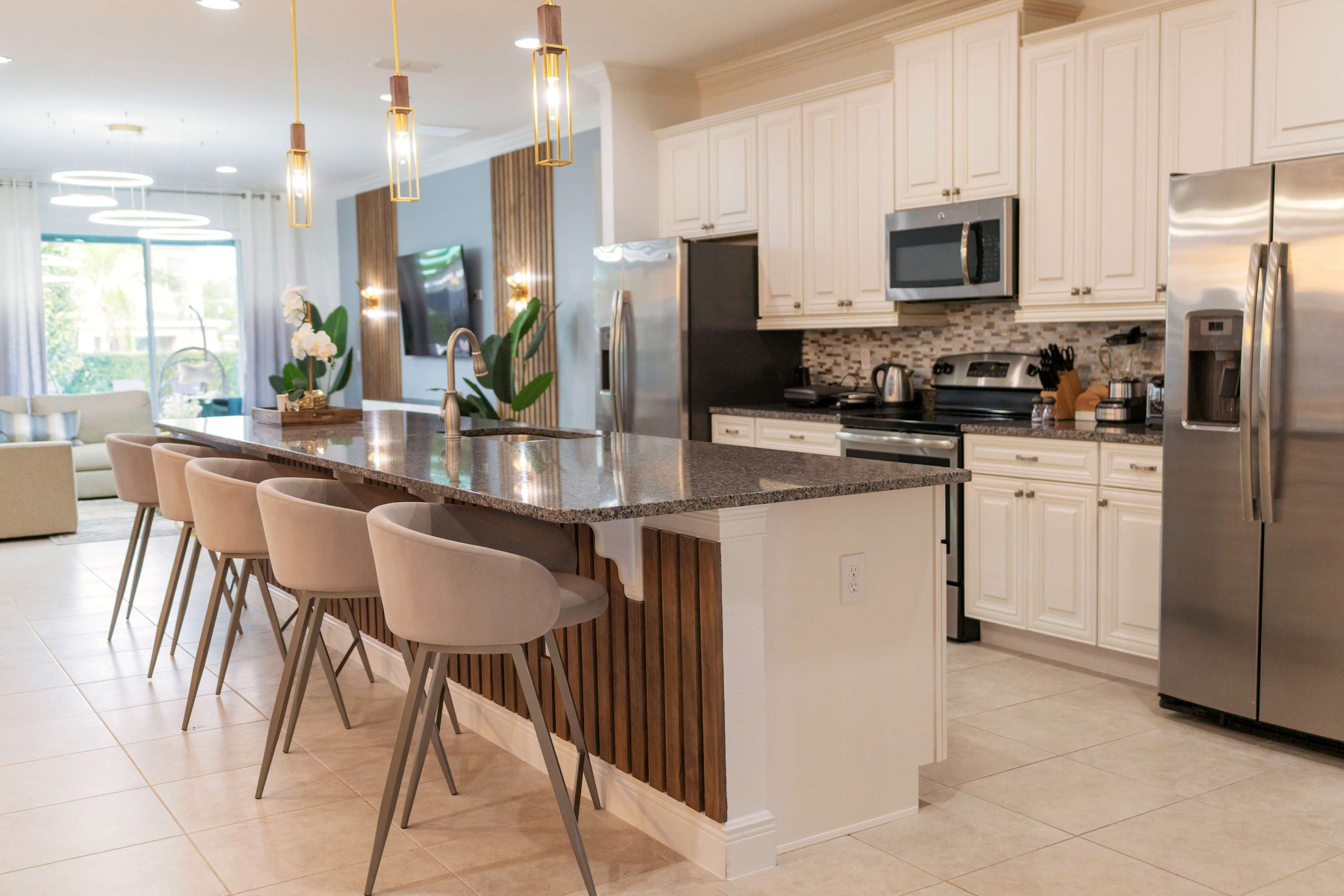 Elegant kitchen with modern amenities and a spacious island, perfect for entertaining and family gatherings.
