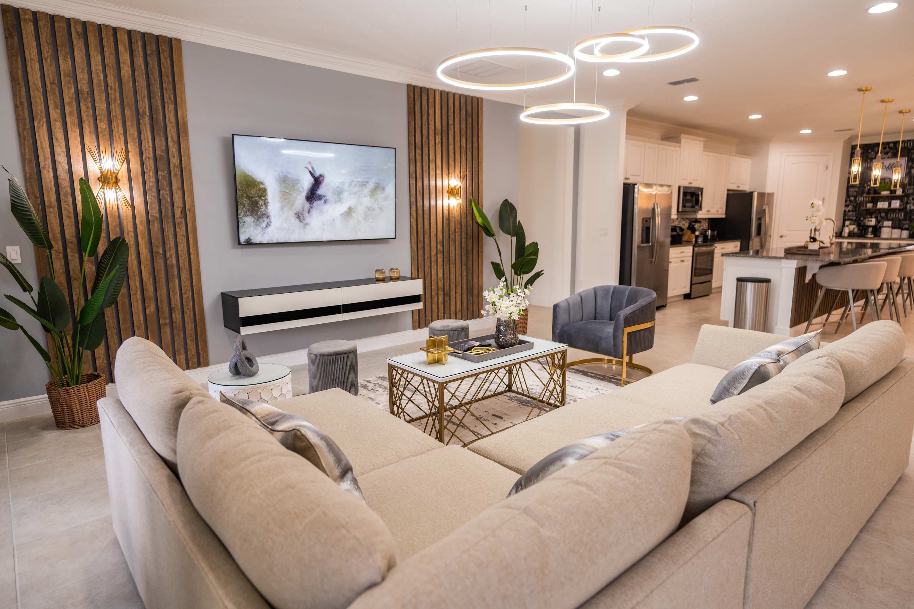 Relax in this stylish living room with modern decor and open kitchen access, perfect for entertaining.