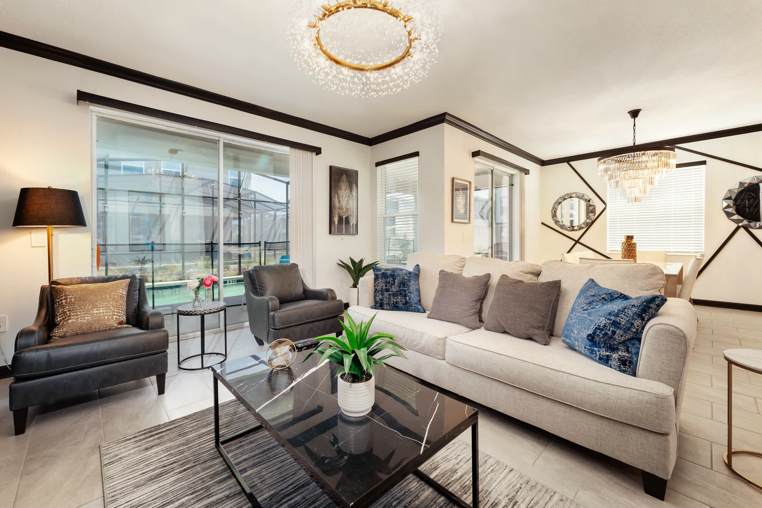 Elegant and spacious living area with modern decor and ample natural light, perfect for relaxation and gatherings.