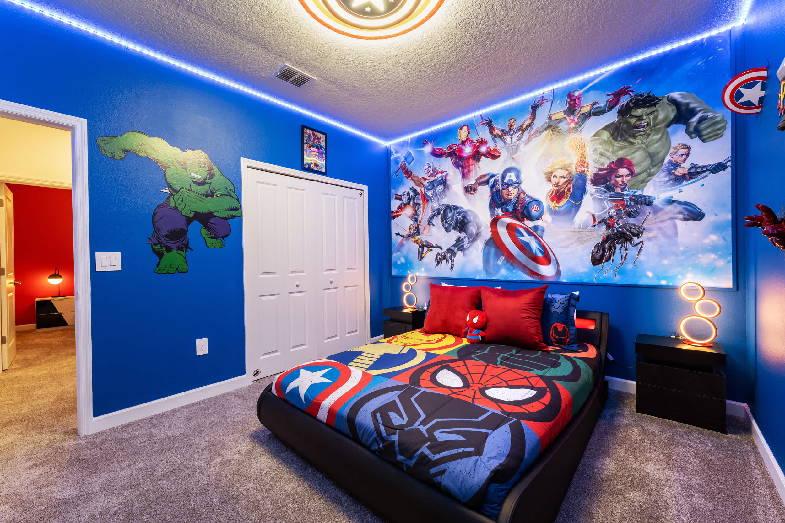 Immerse yourself in a superhero adventure with vibrant decor and themed bedding in this exciting room, perfect for fans of all ages.