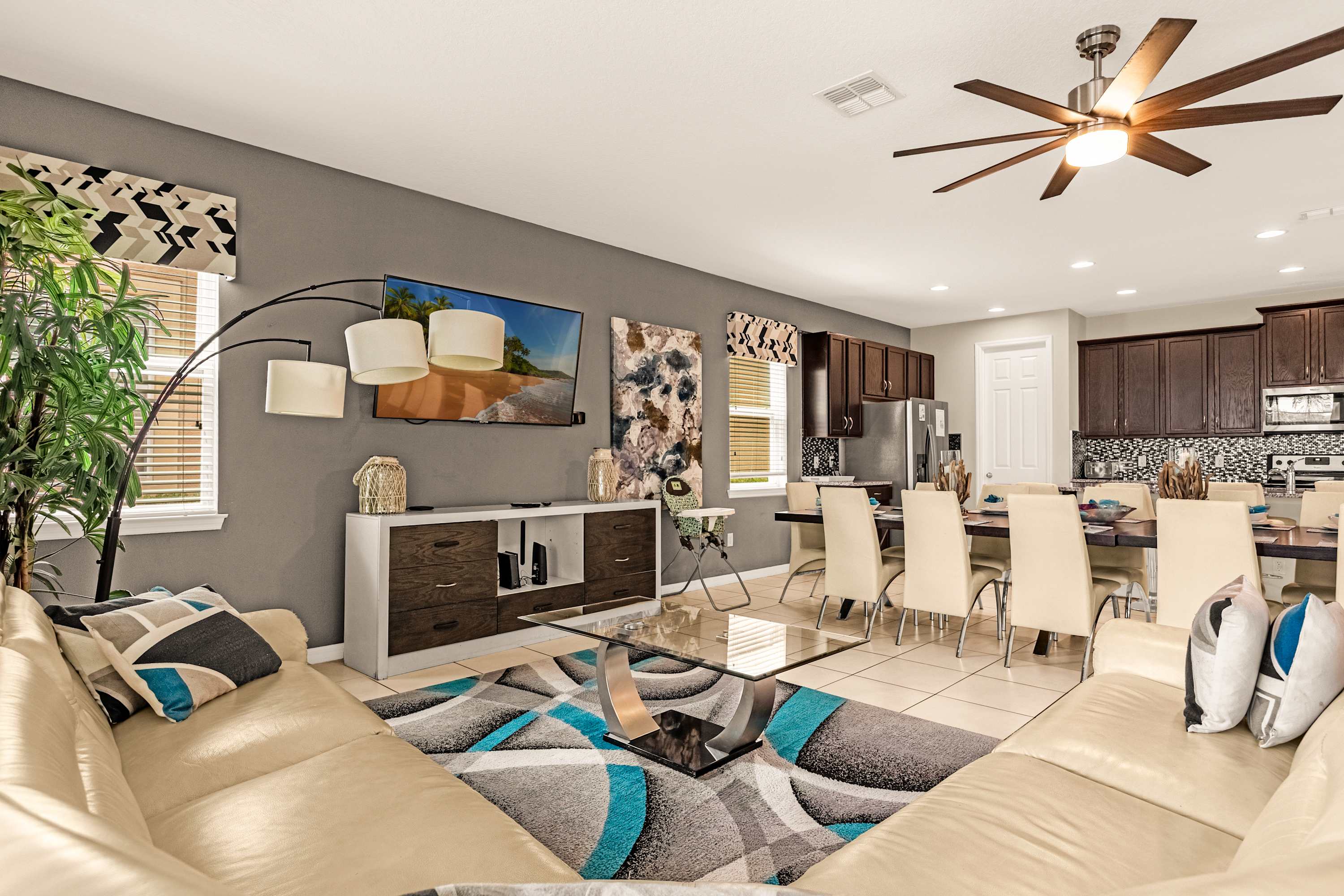 Spacious open-concept living and dining area perfect for entertaining, featuring modern decor and ample seating.