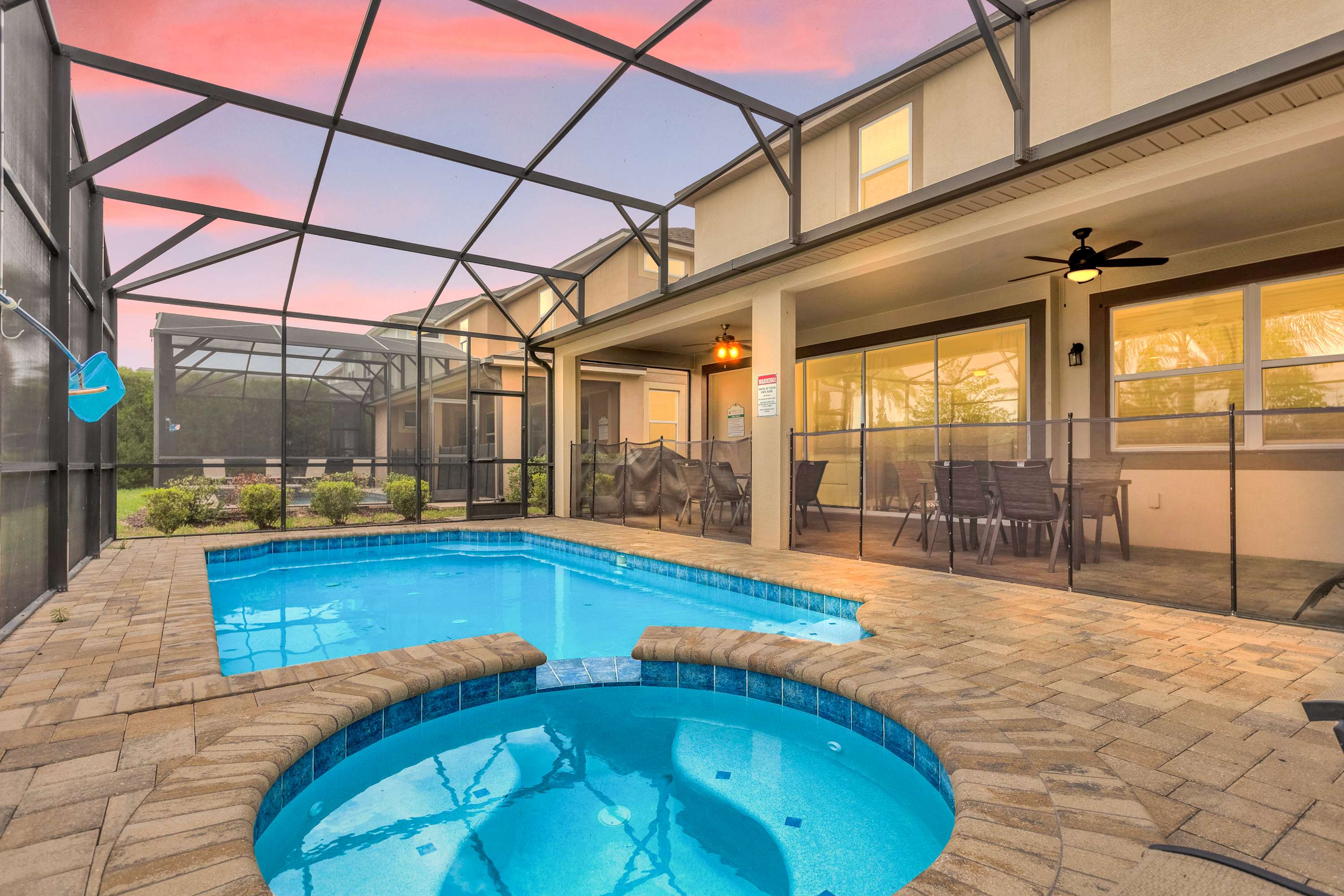 Relax in your private screened pool and hot tub oasis, perfect for unwinding after a day of adventure.