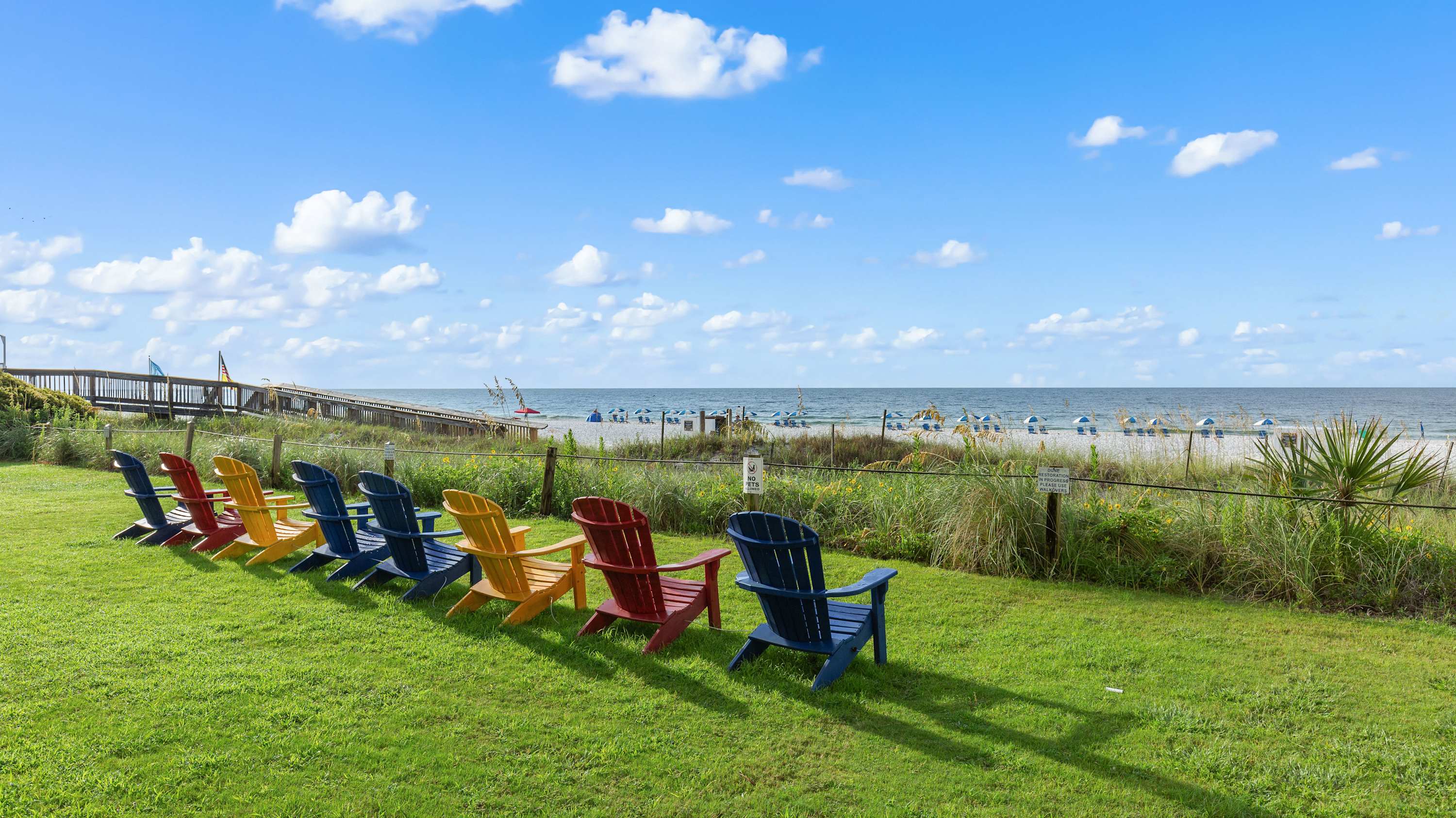 Enjoy the sound of ocean waves while you lounge in comfy Adirondak chairs​