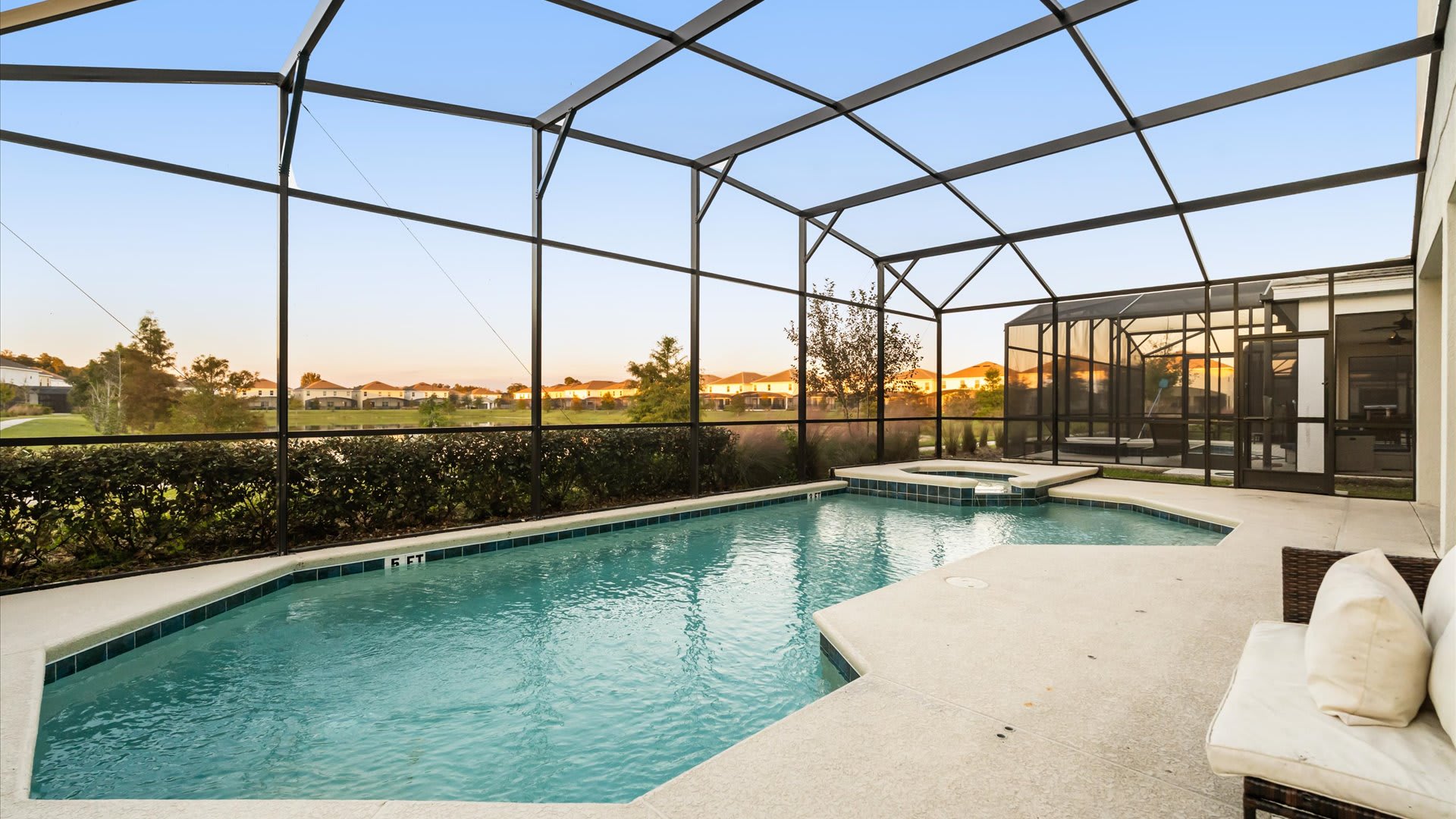 Sparkling private screened-in pool with serene views — perfect for morning swims or relaxing afternoons.
