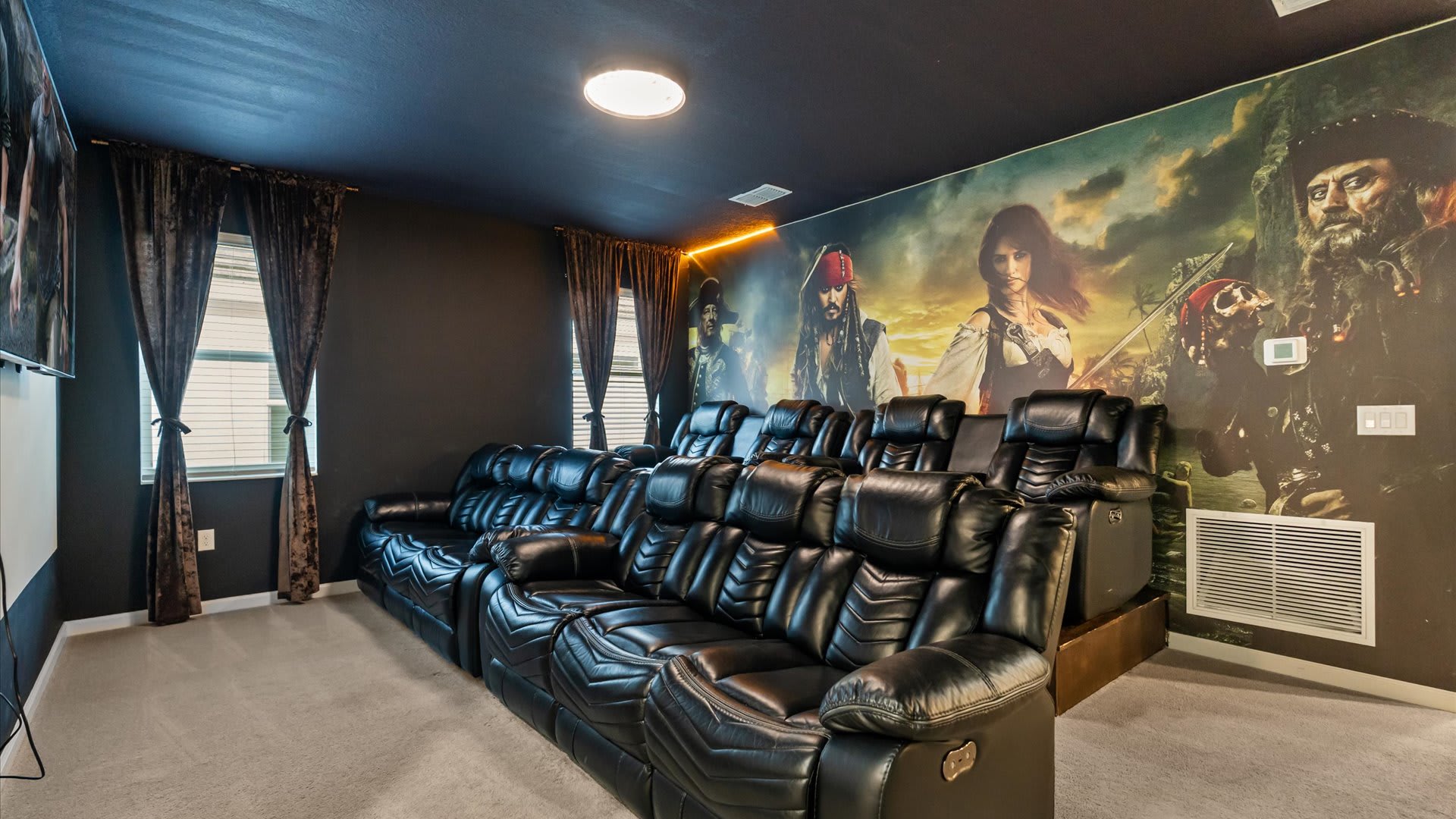 Private cinema with luxury recliners, surround sound, and a large screen — the ultimate movie night experience.