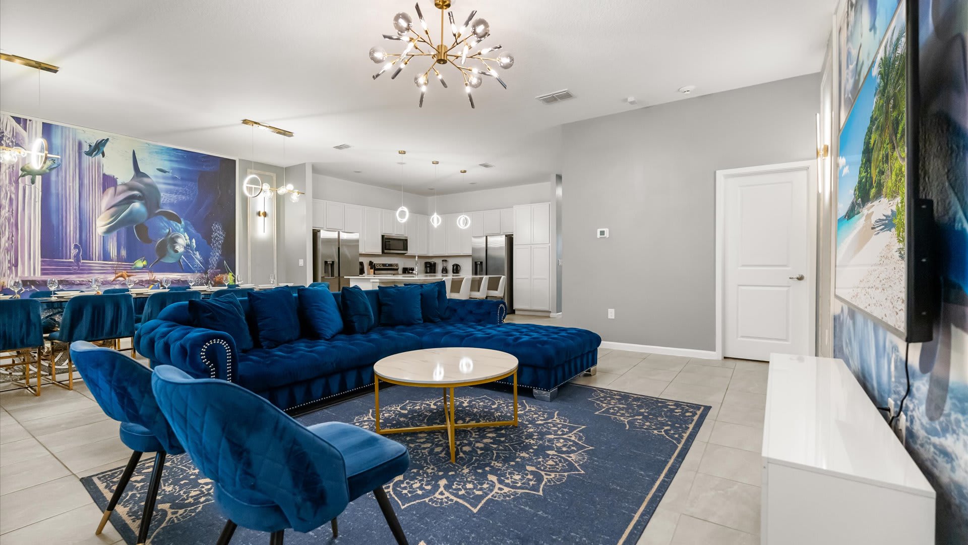 Upscale living room with striking blue seating — perfect for gathering and relaxing together.