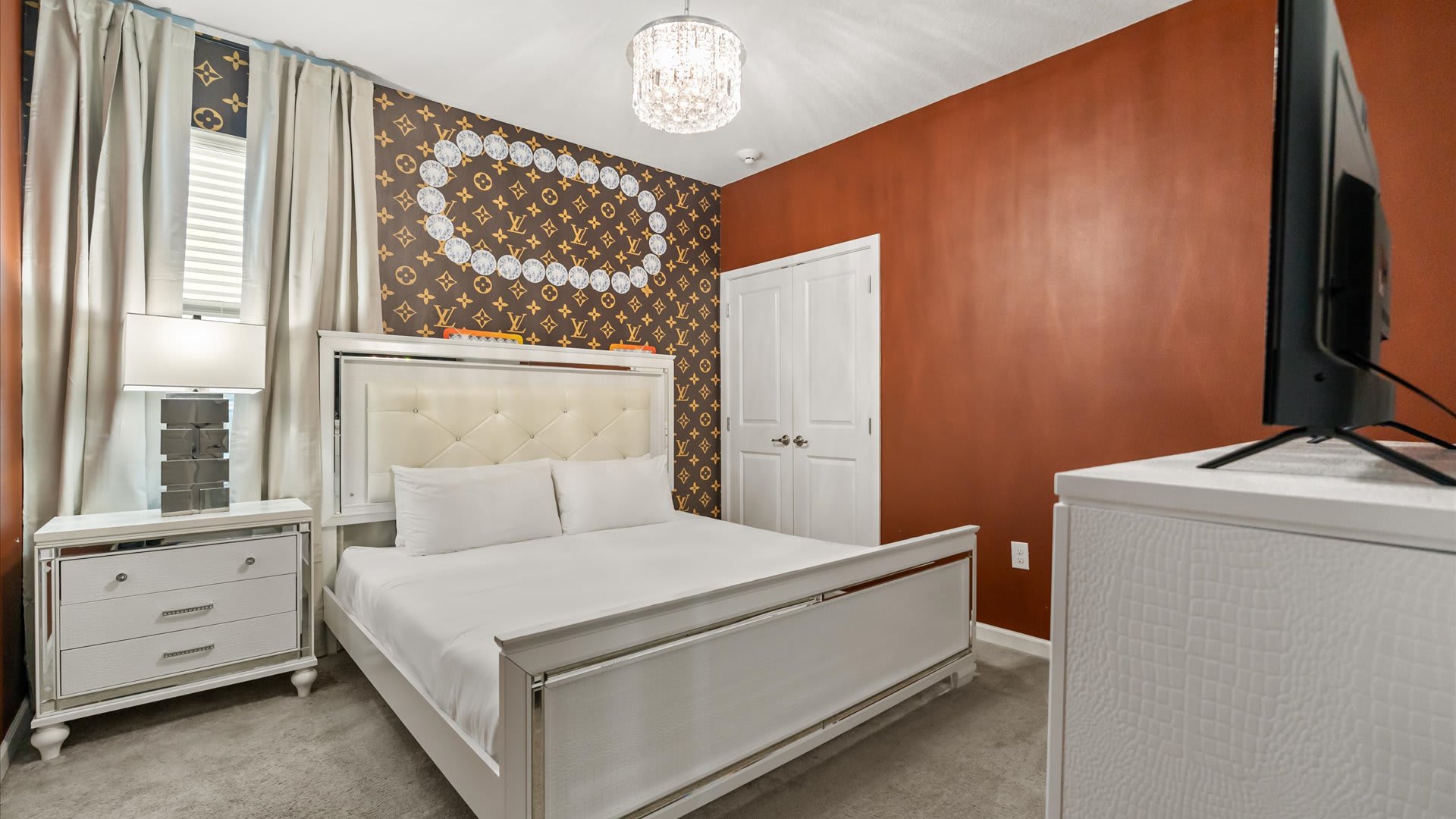 Bedroom 7 – Spacious king suite with warm accents and calming lighting.
