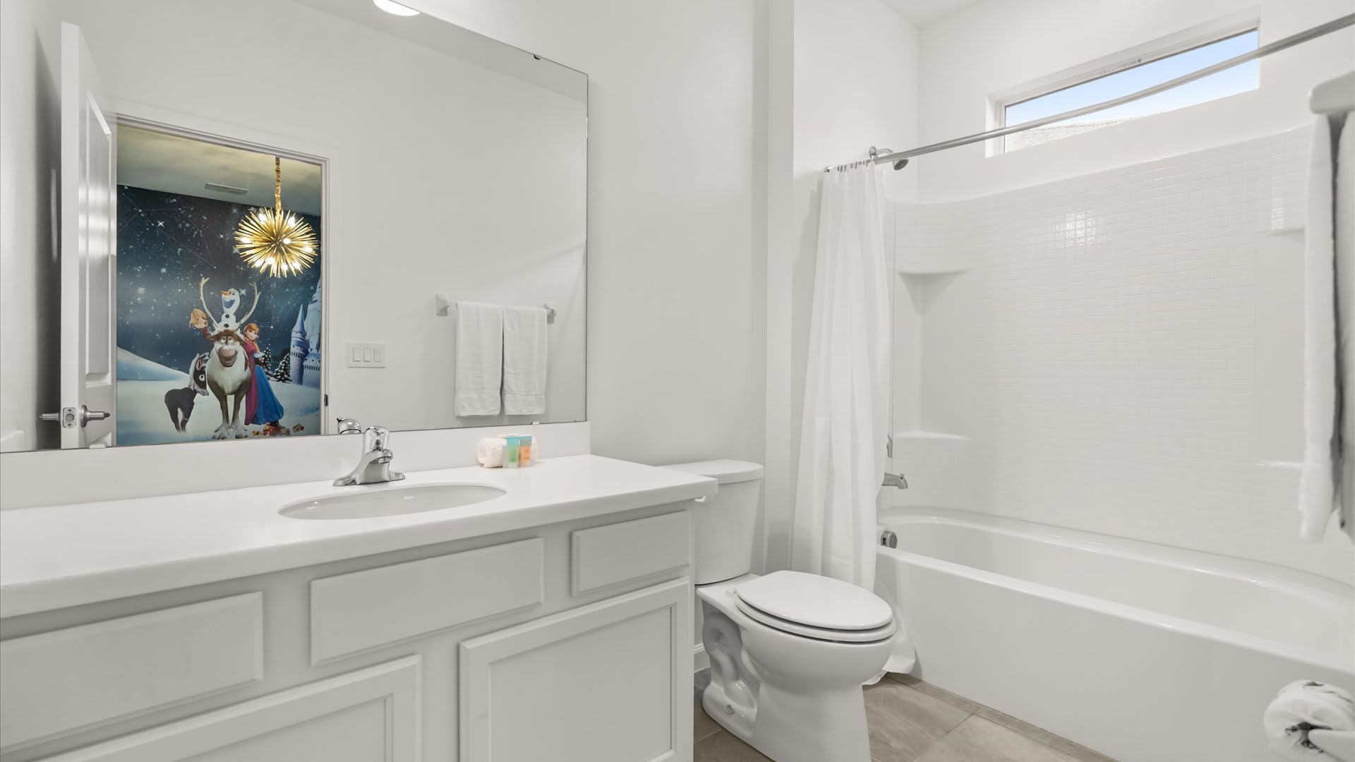 Frozen bedroom en-suite bathroom with shower + tub combo