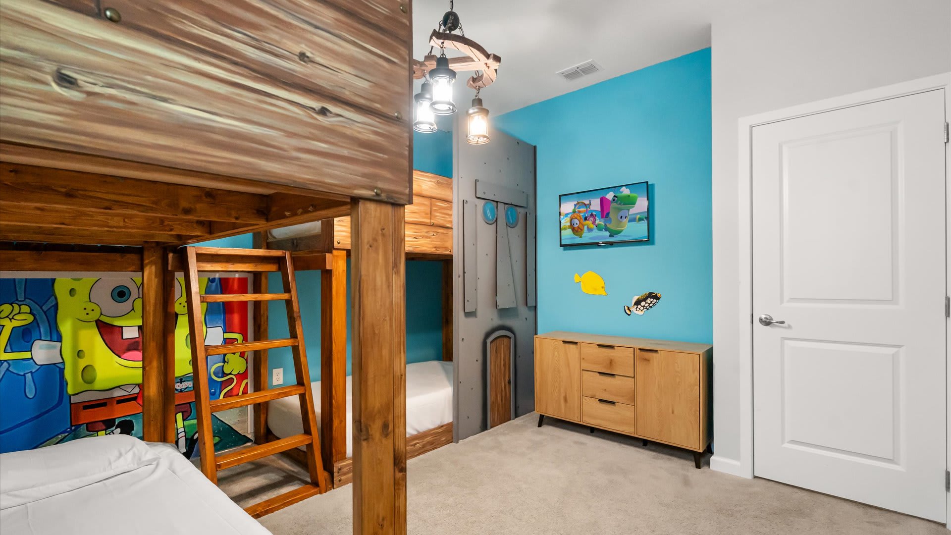 Bedroom 9 – SpongeBob twin bunk room designed with kids in mind — bright, playful, and perfect for siblings or friends. 