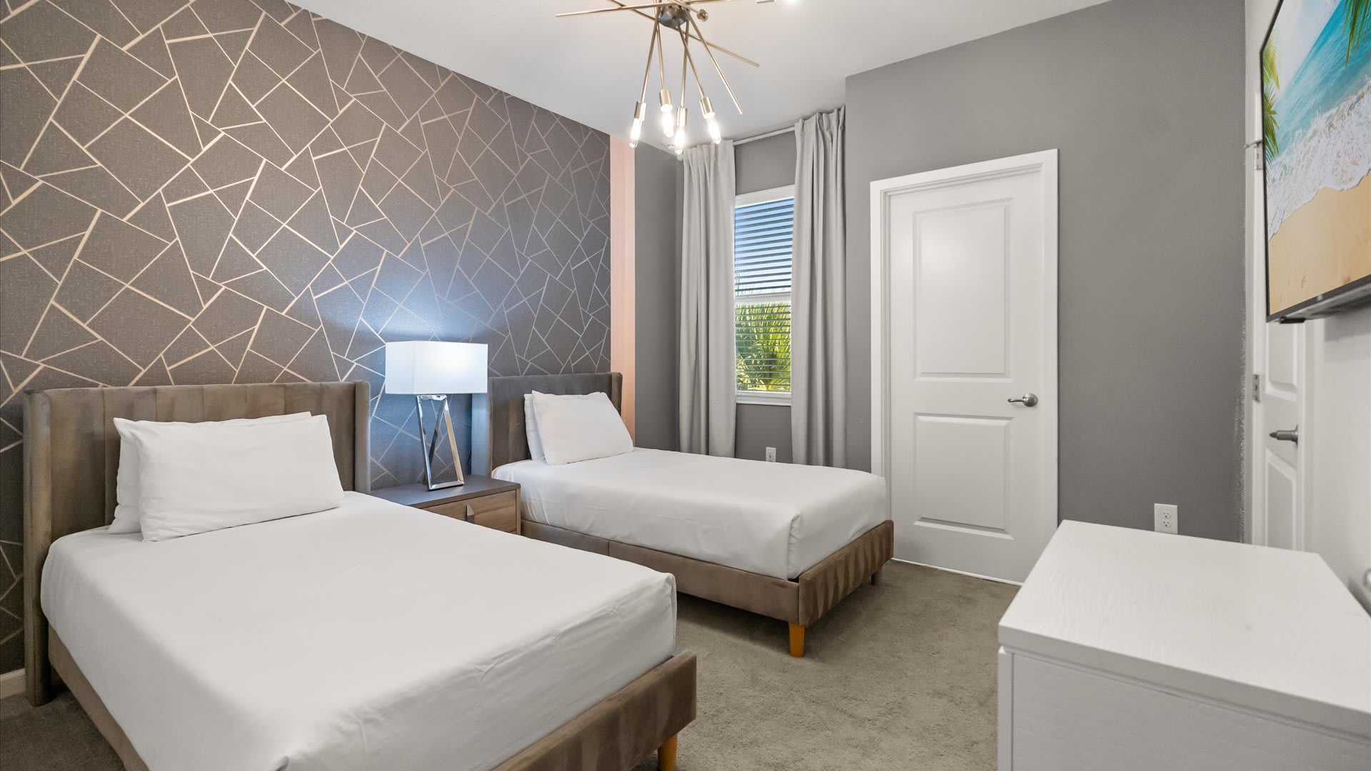 Bedroom 11 – Twin bedroom with modern decor and a Smart TV + En-suite