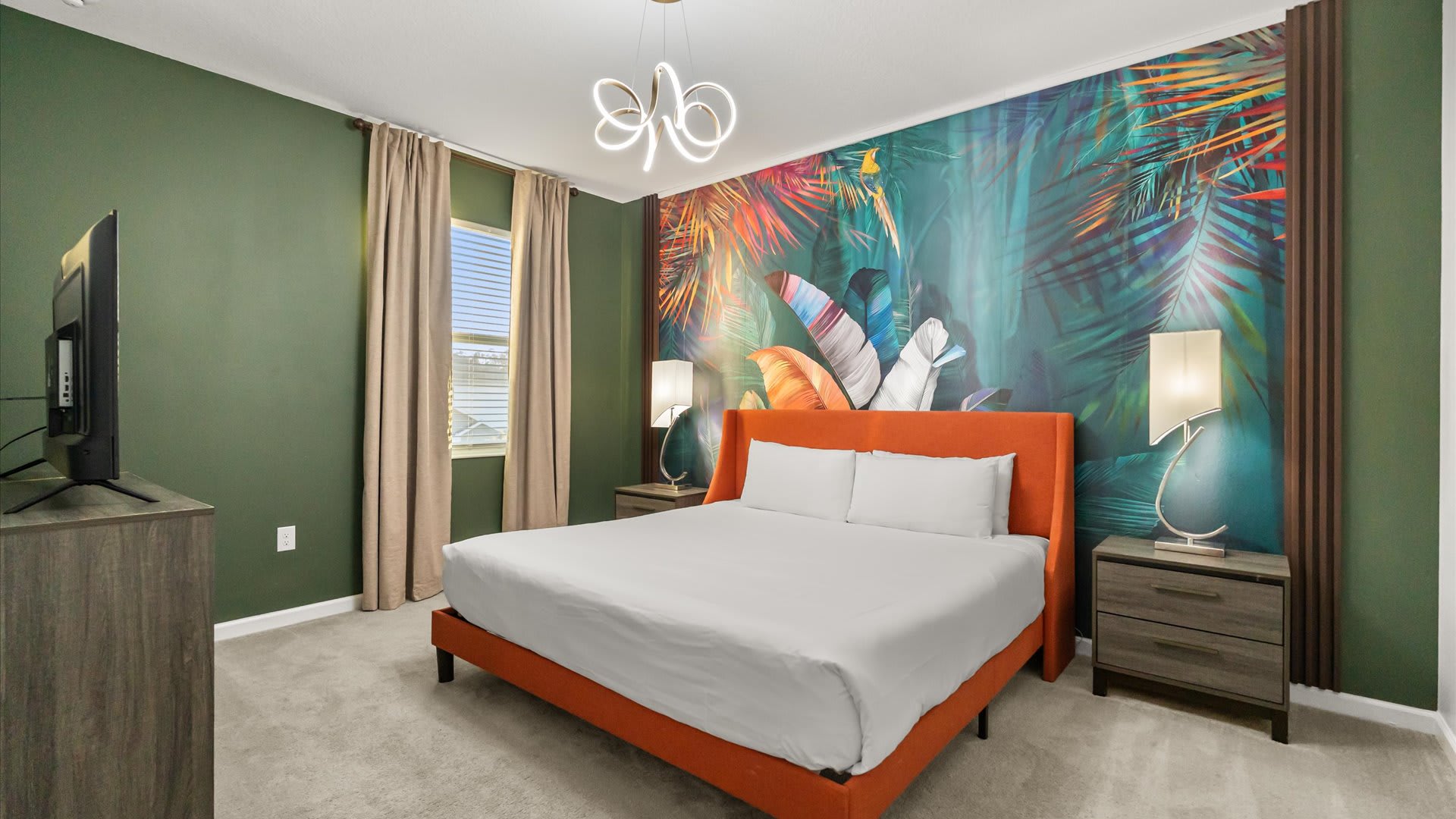 Bedroom 12 – Stylish king suite with vibrant wall art and cozy ambience.