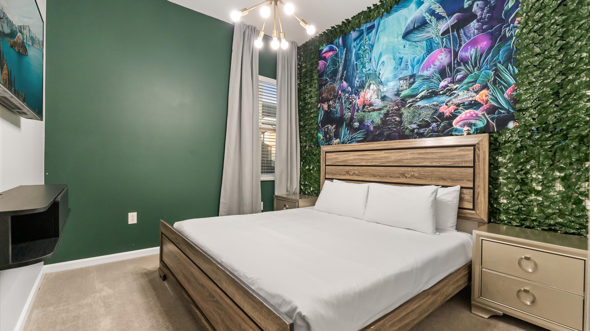 Bedroom 2 – Peaceful king suite with forest-inspired mural and soft lighting.