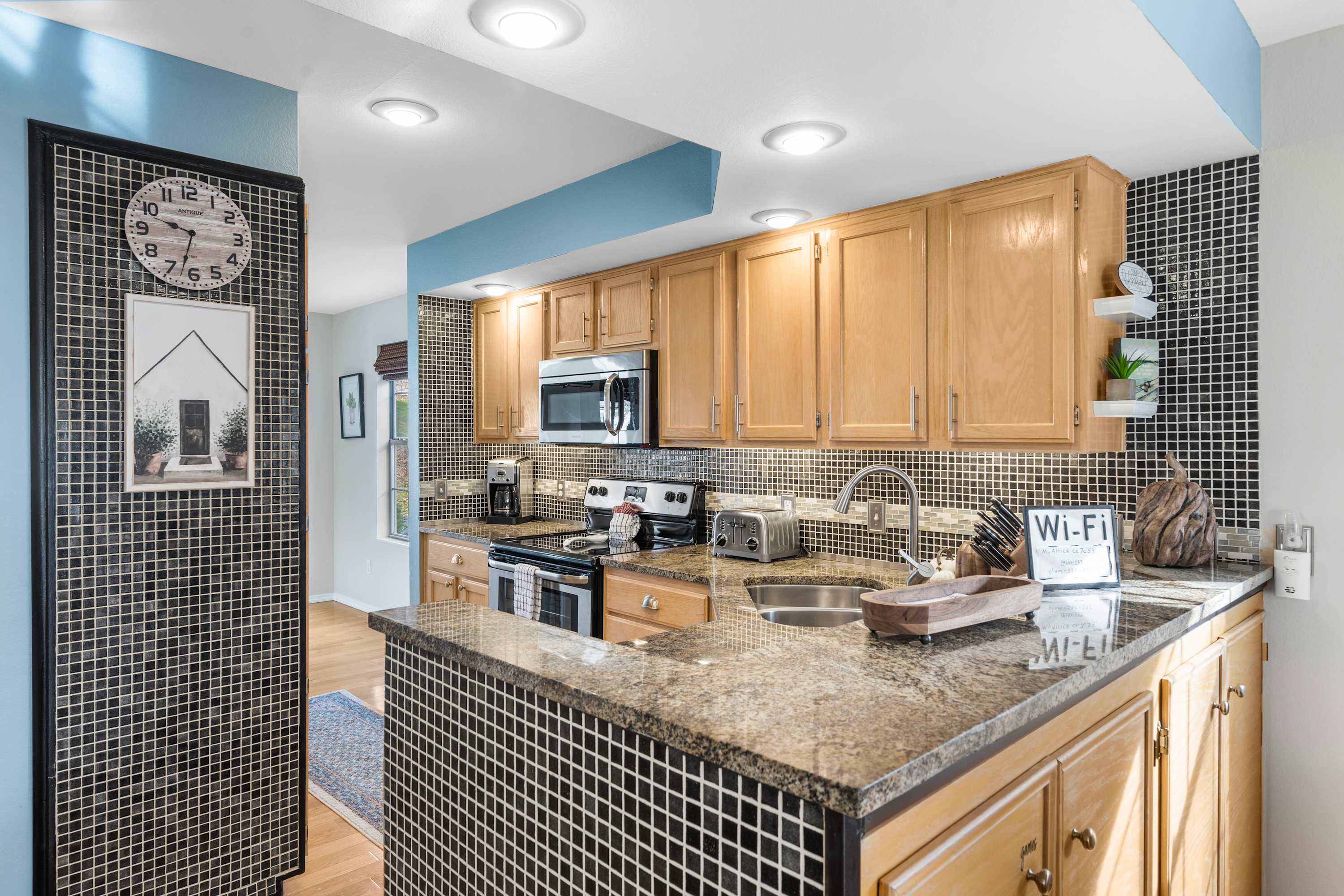 The open kitchen offers ample space & all the comforts of home​