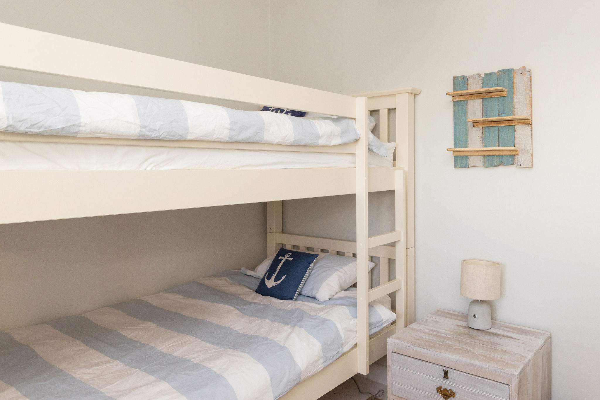 Fun coastal bunk room perfect for children.