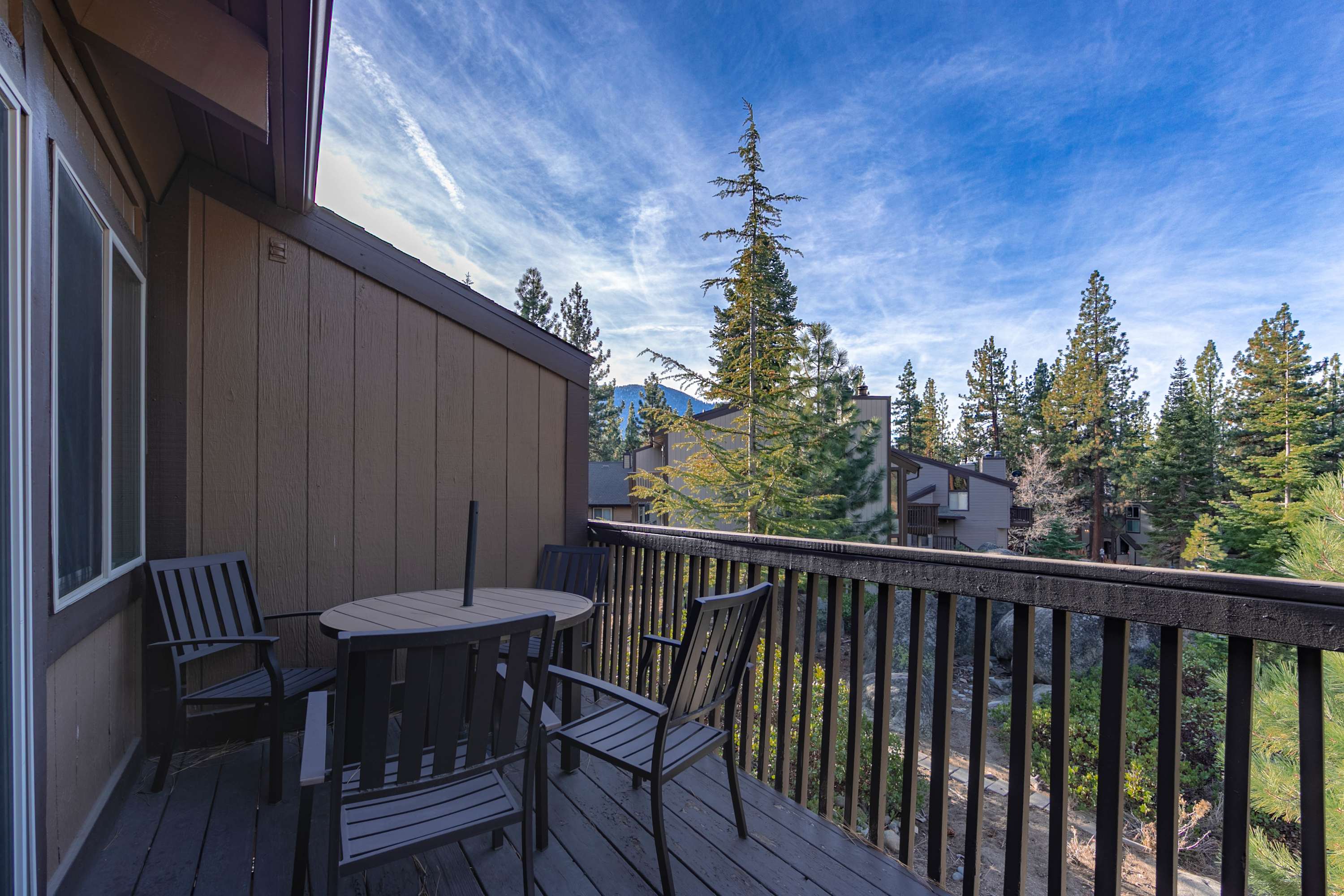 Breathe in fresh mountain air from the balcony with grill and outdoor seating
