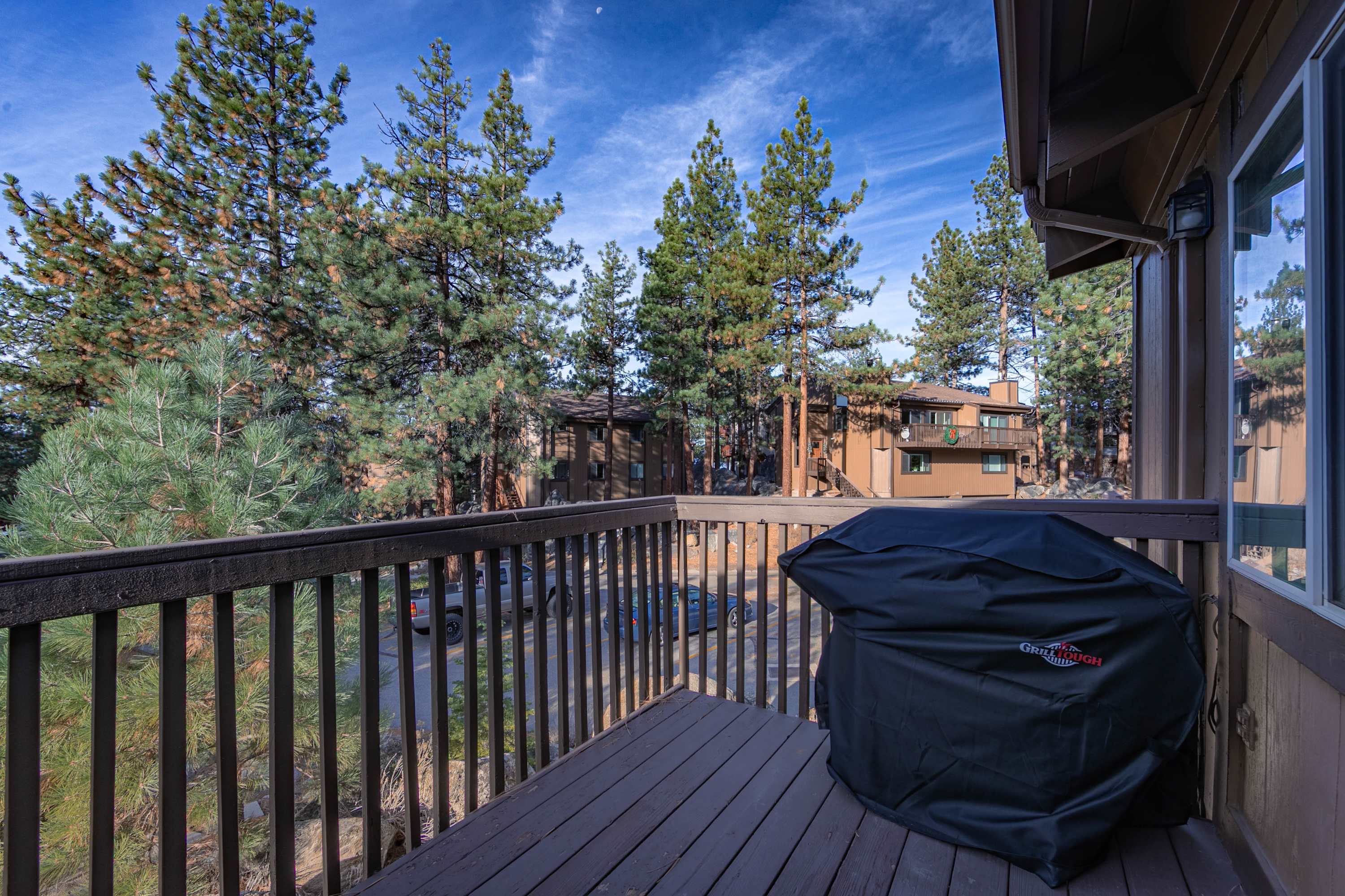 Breathe in fresh mountain air from the balcony with grill and outdoor seating