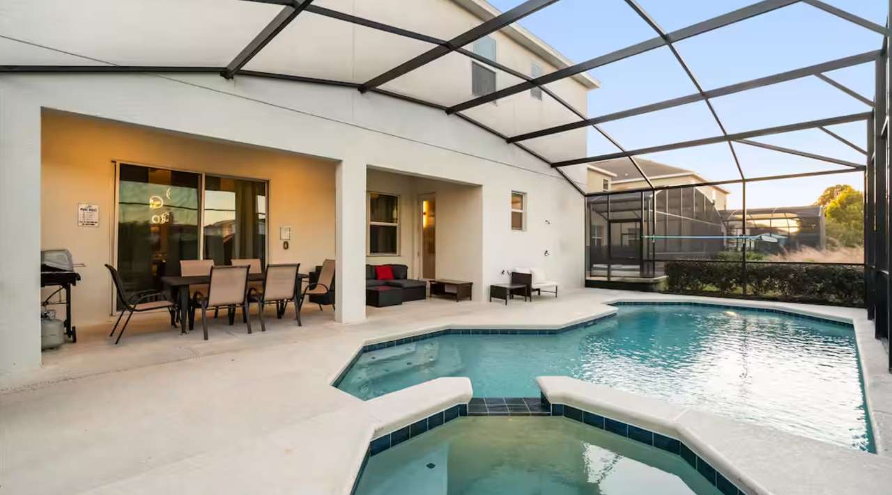 Sparkling private screened-in pool with serene views — perfect for morning swims or relaxing afternoons.