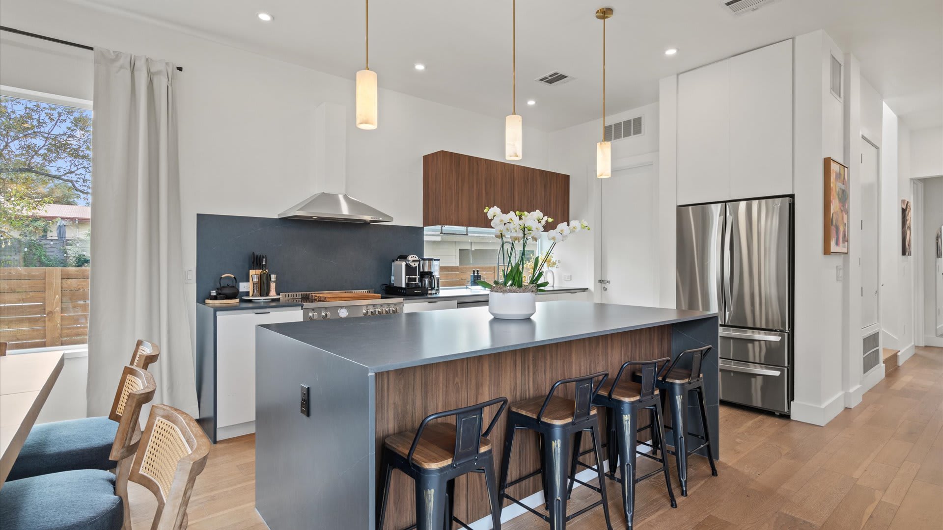 Open-concept kitchen and dining area with abundant natural light