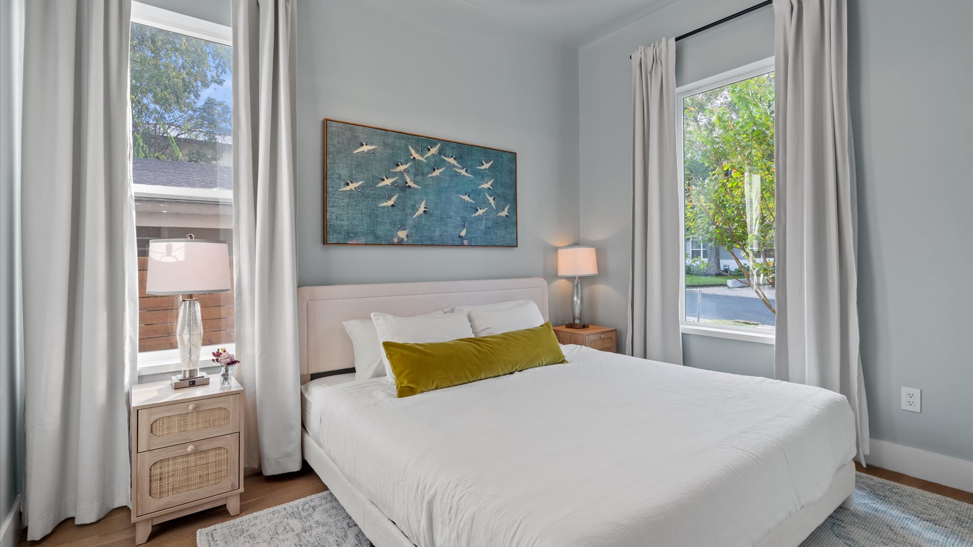 Peaceful bedroom with plush bedding and soft natural light