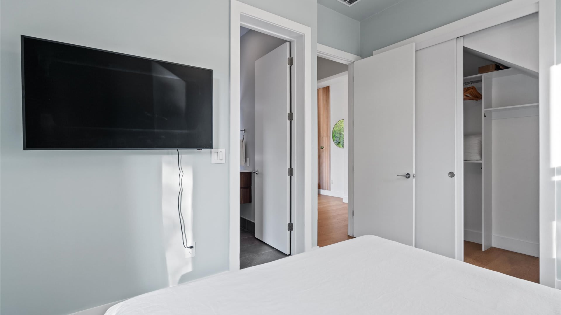 Smart TV + ample storage in the primary bedroom