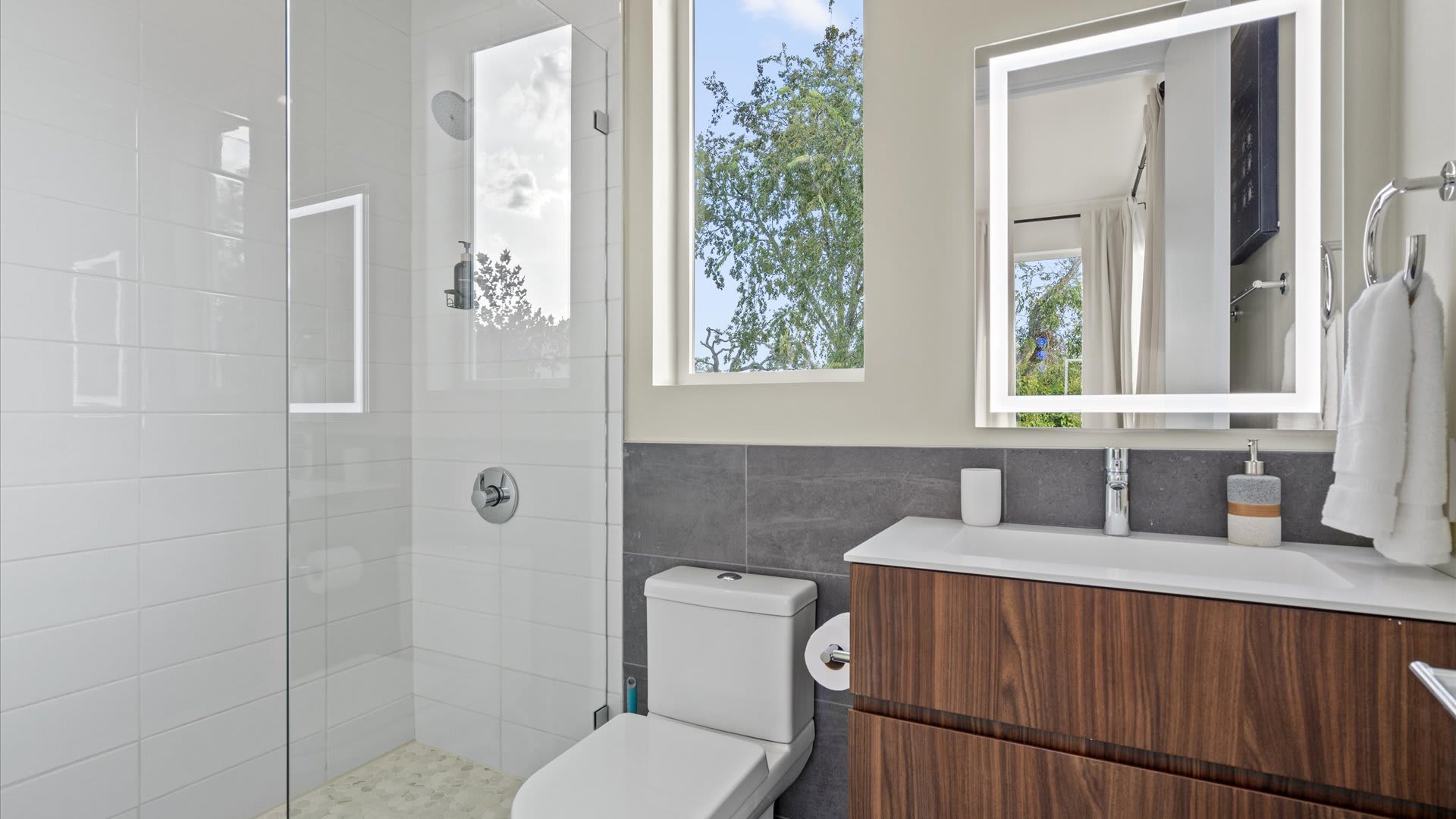 Bathroom with glass walk-in shower and modern fixtures