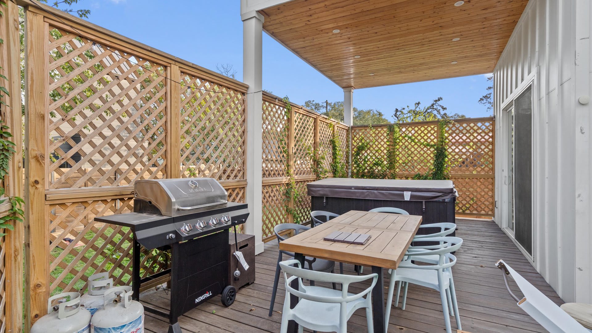 Outdoor fire pit surrounded by comfortable lounge chairs