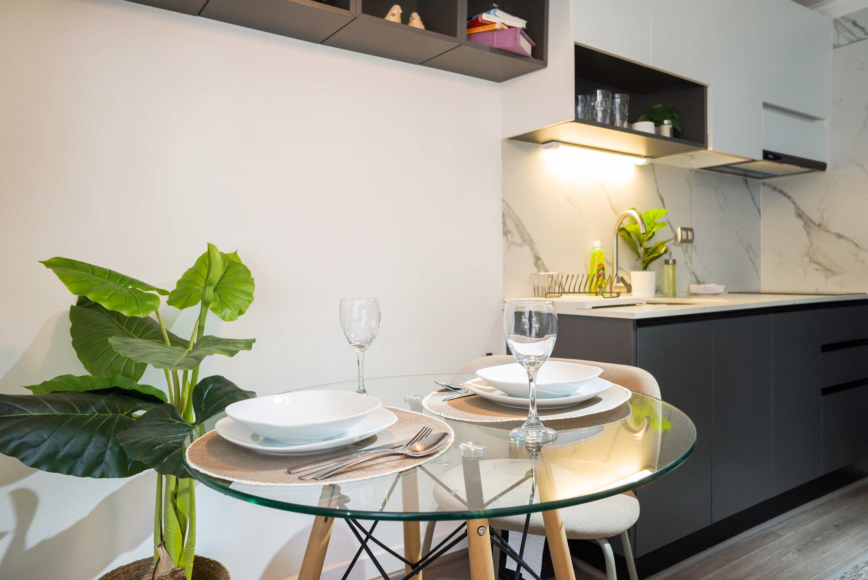 Chic and cozy kitchen with elegant dining setup, perfect for intimate meals.
