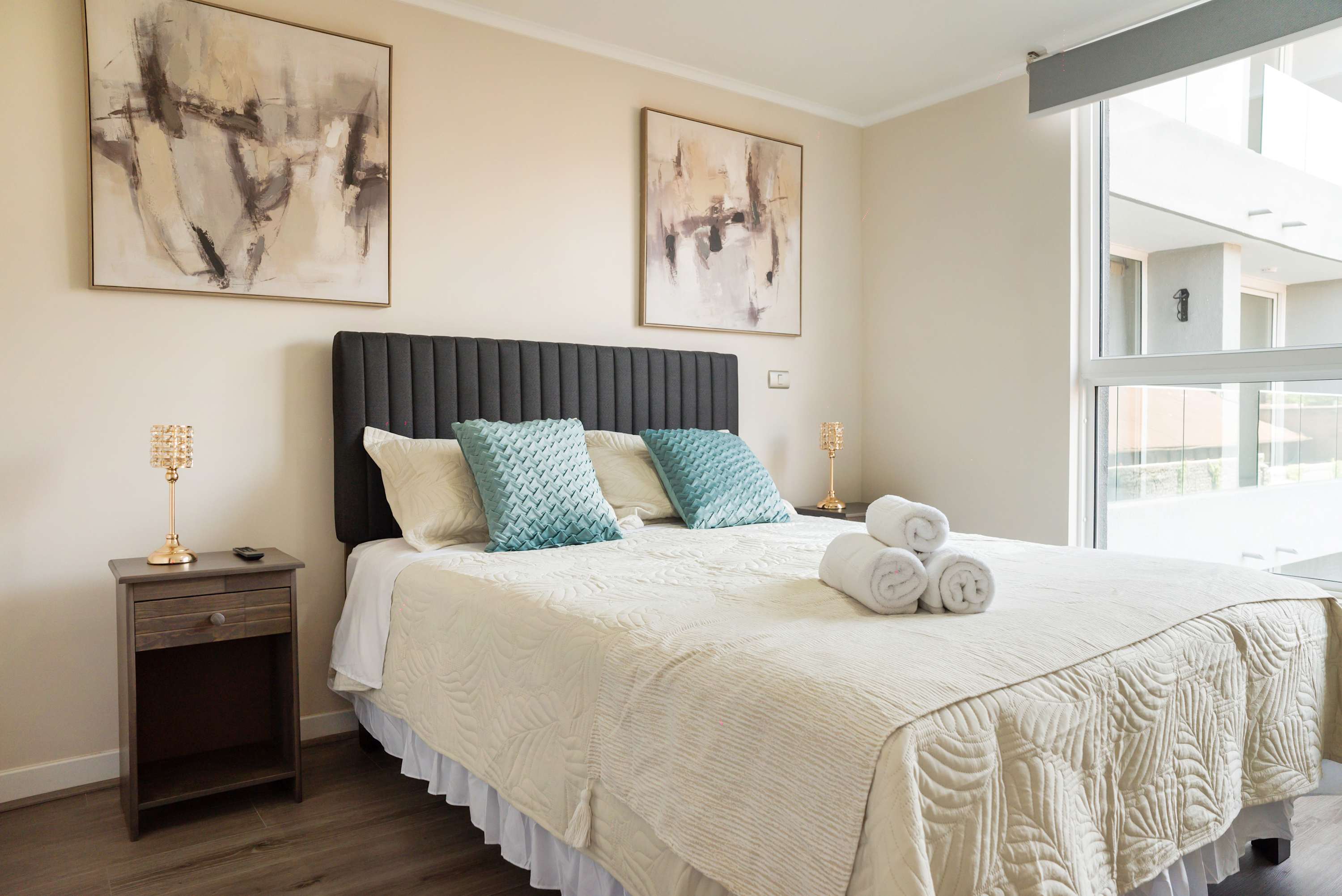 Relax in this cozy bedroom with a plush bed and stylish decor, perfect for a restful stay.